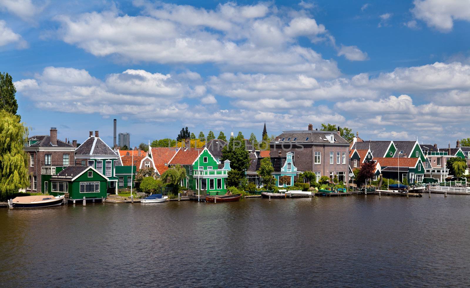 old green traditional houses in town Zaanse Schans in Netherlands