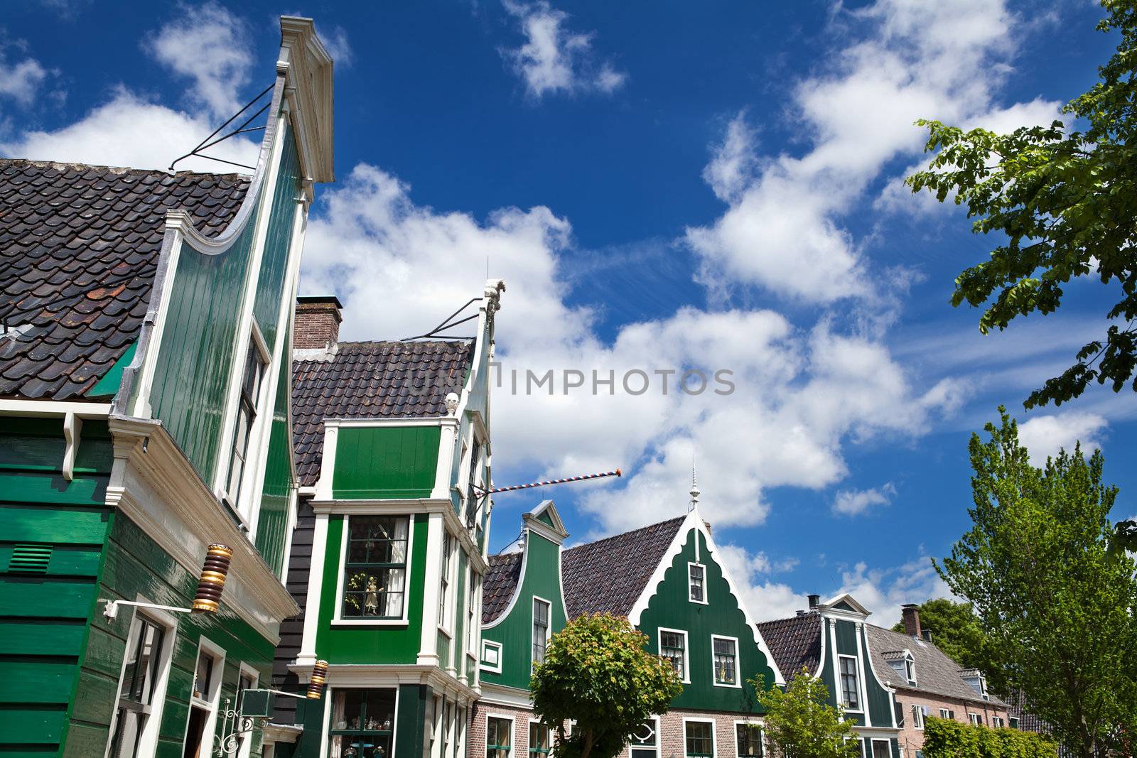 green traditional buildings in small Dutch town Zaanse Schans