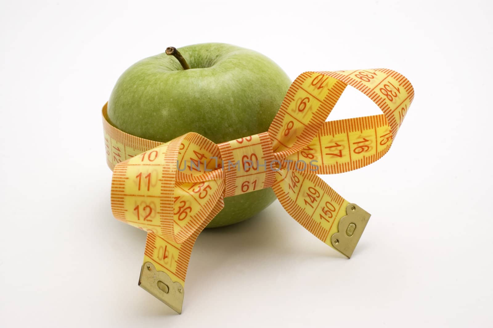 Green Apple with measuring tape.