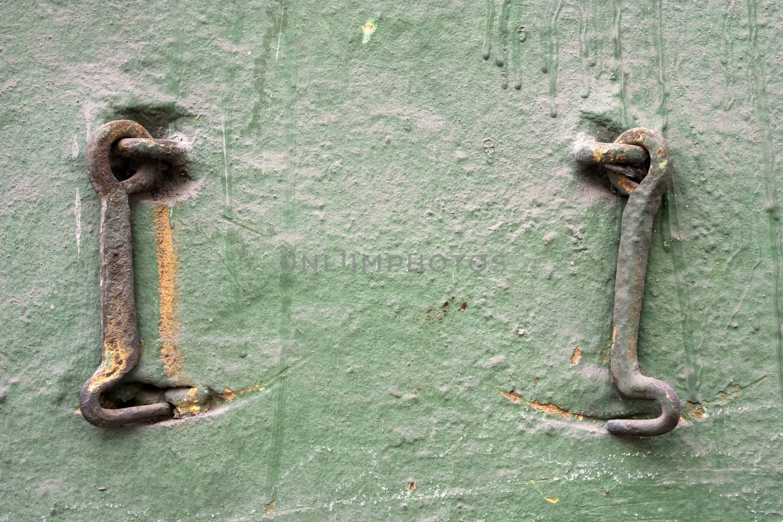 Two old metal hooks.