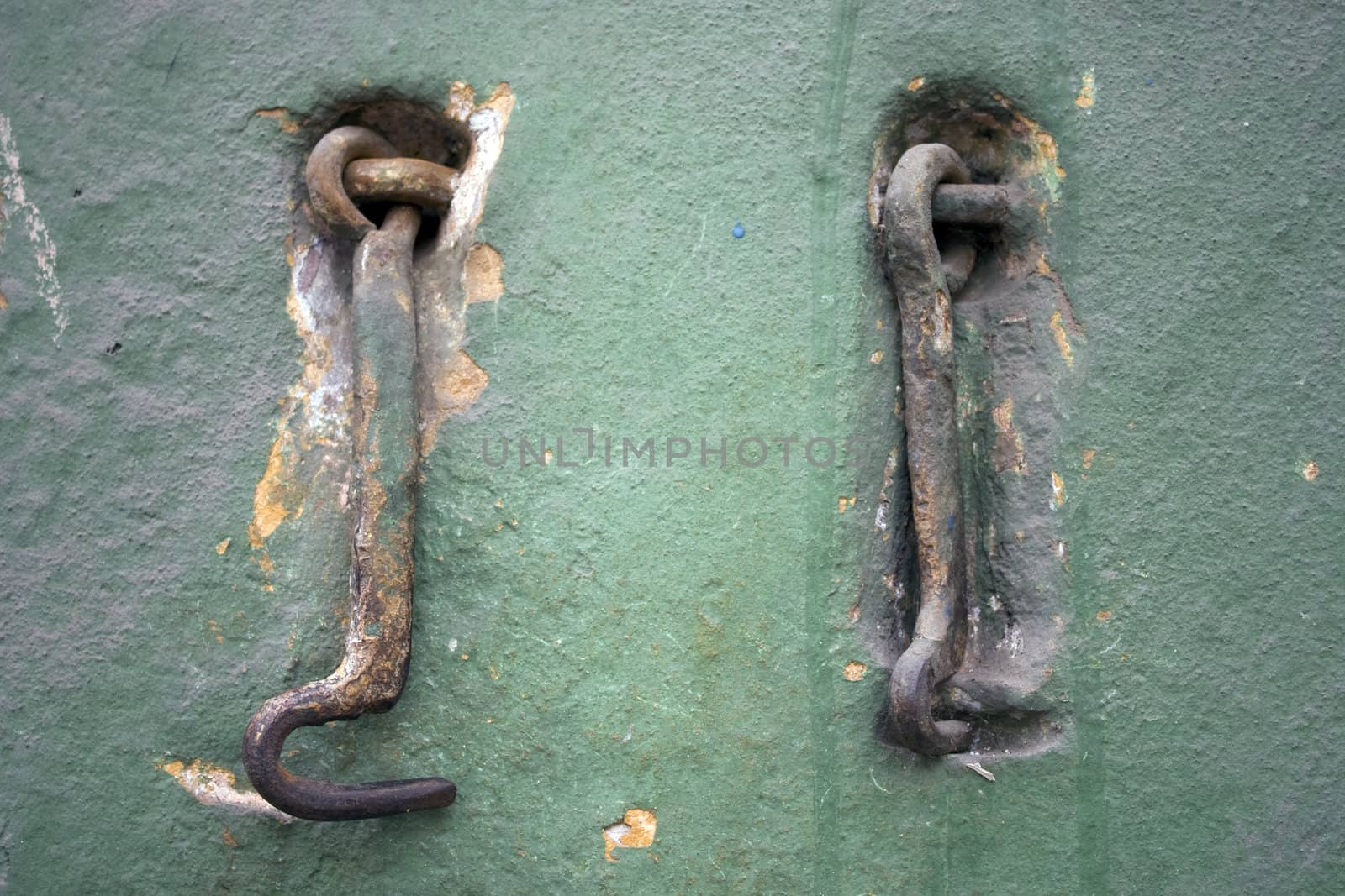 Two old metal hooks.