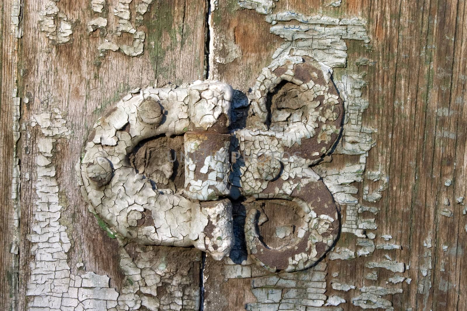 Old metal details on an old board.