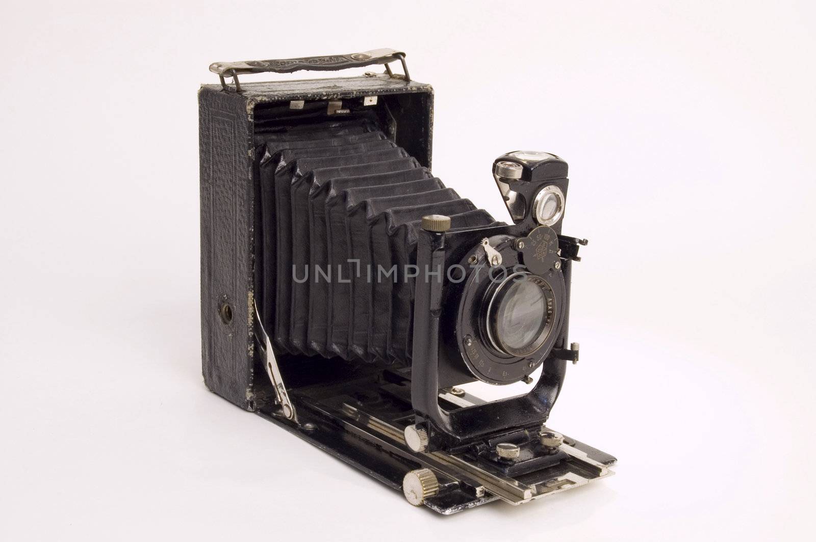The old photographic chamber with a lens of furs on a white background.