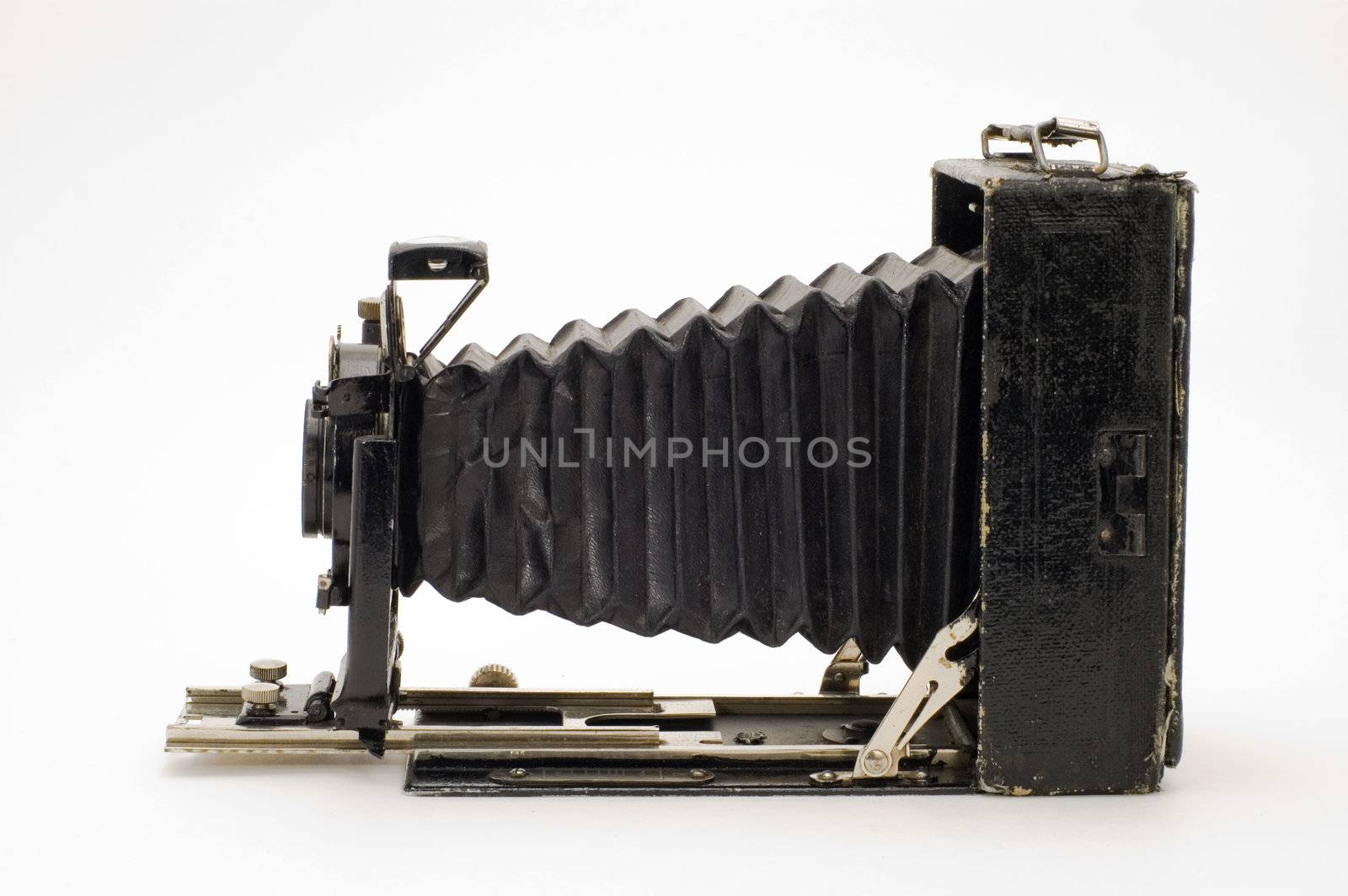 The old photographic chamber with a lens of furs on a white background.