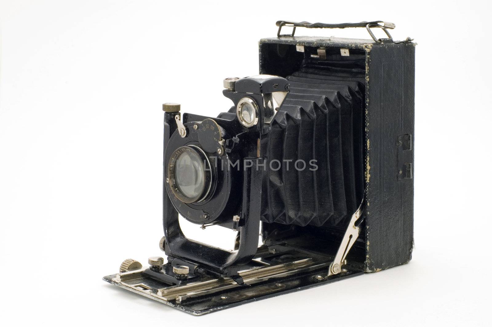The old photographic chamber with a lens of furs on a white background.