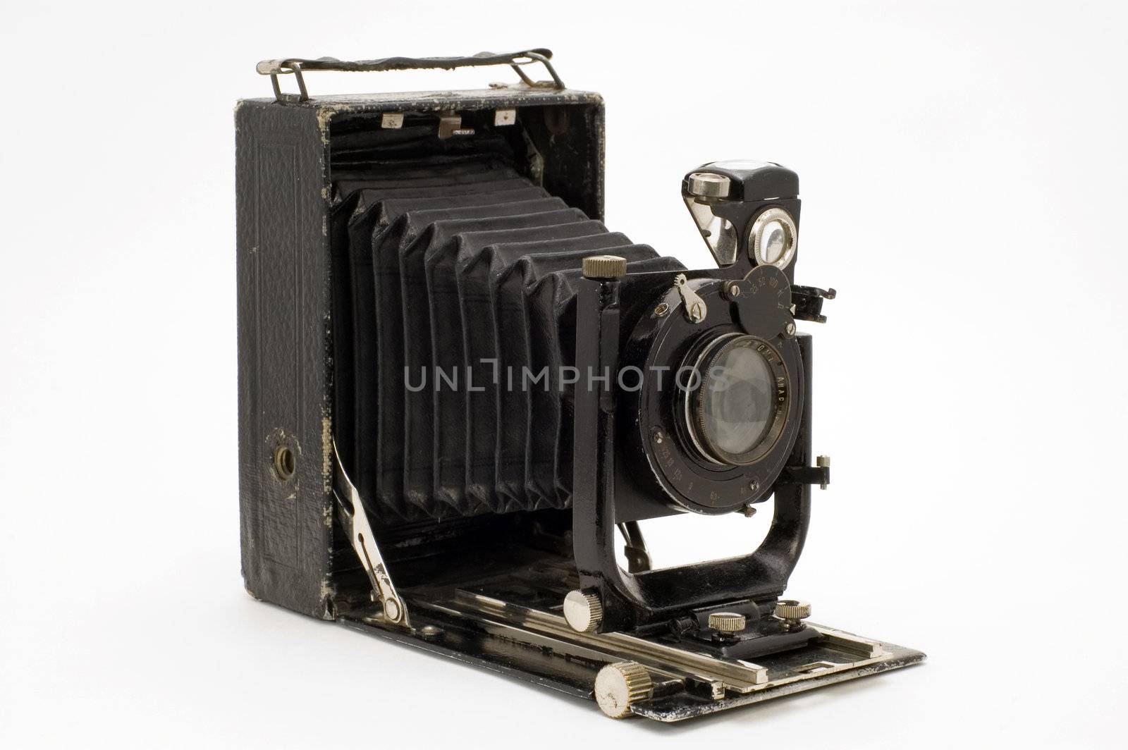 The old photographic chamber with a lens of furs on a white background.
