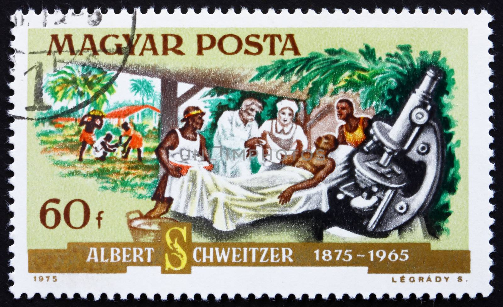 HUNGARY - CIRCA 1975: a stamp printed in the Hungary shows Dr. Albert Schweitzer, Patient and Microscope, Medical Missionary and Musician, circa 1975