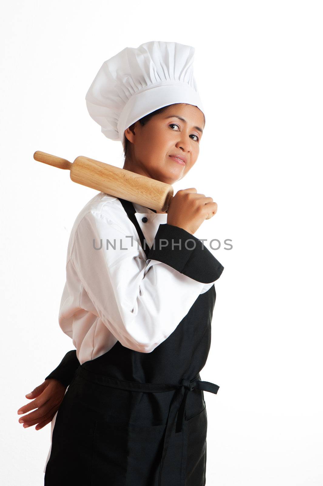 A asian woman as restaurant chef with a rolling pin