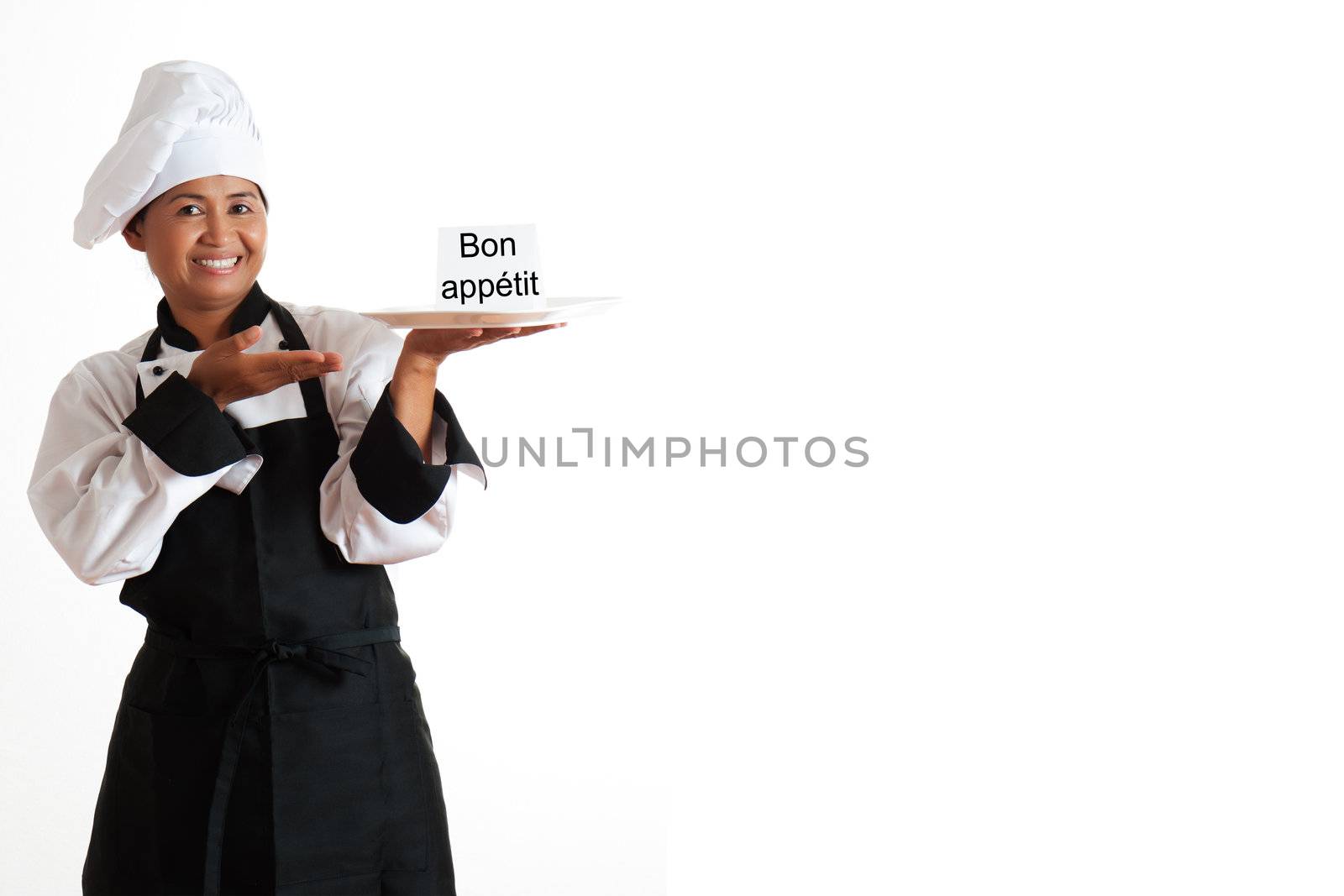 Smiling asian woman as restaurant chef with a plate and label in the hand