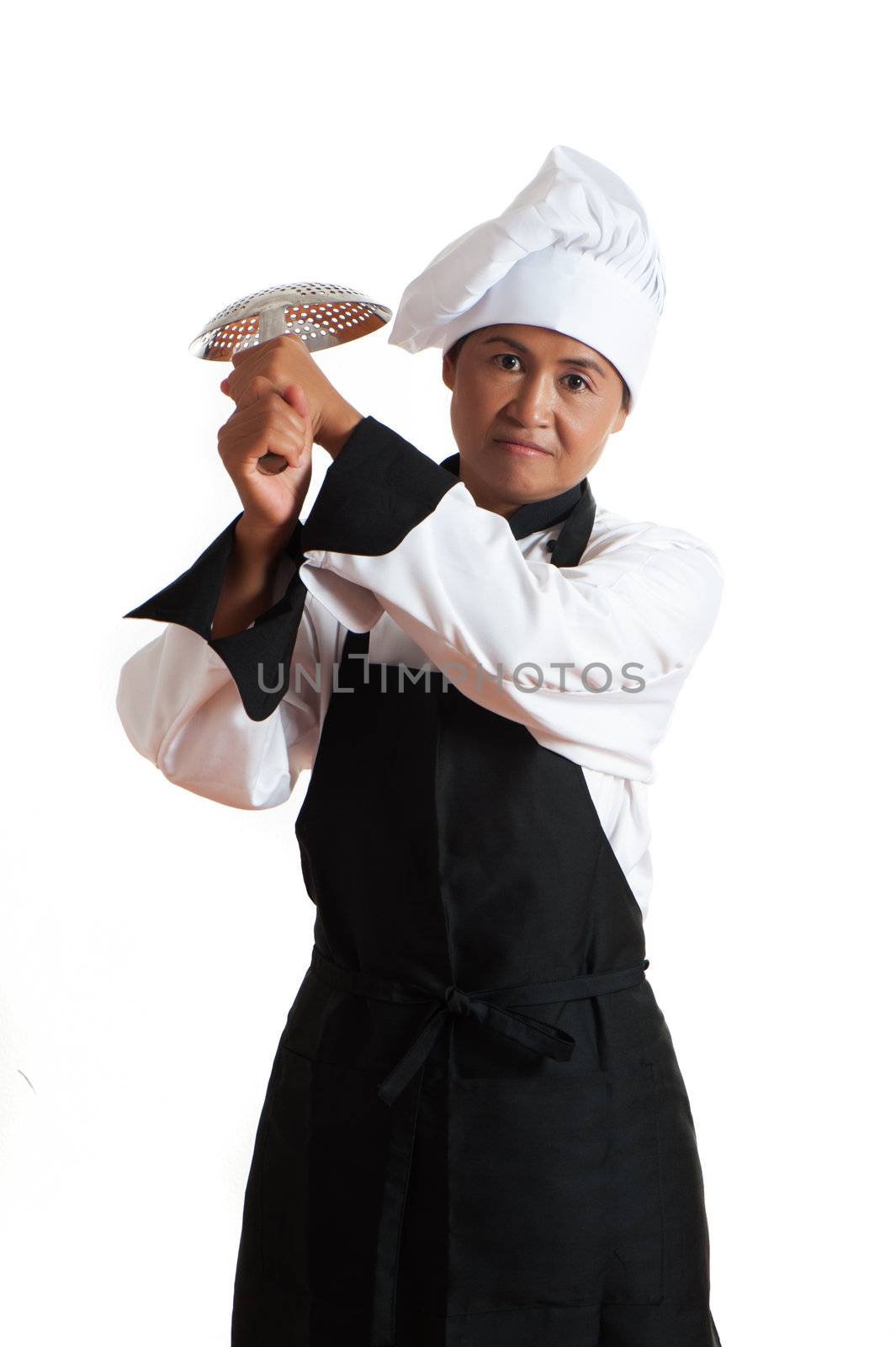 A asian woman as restaurant chef with a kitchen sieve in the hand