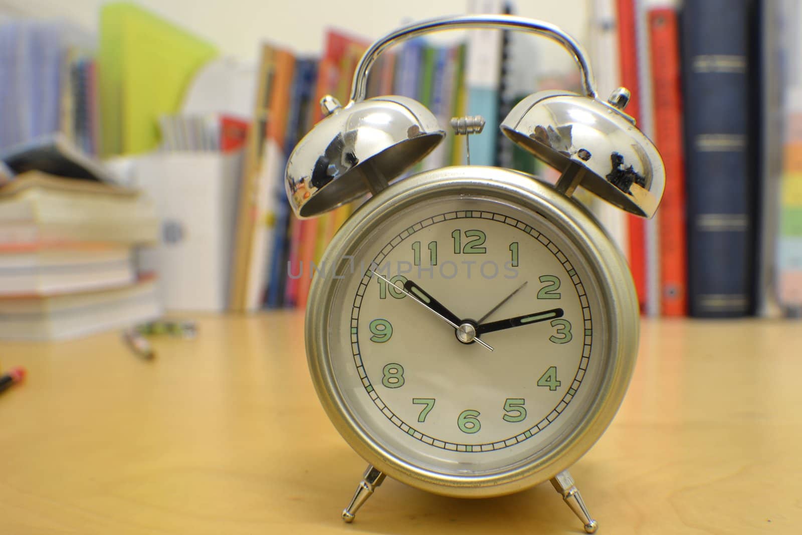 alarm clock on study desk by razihusin