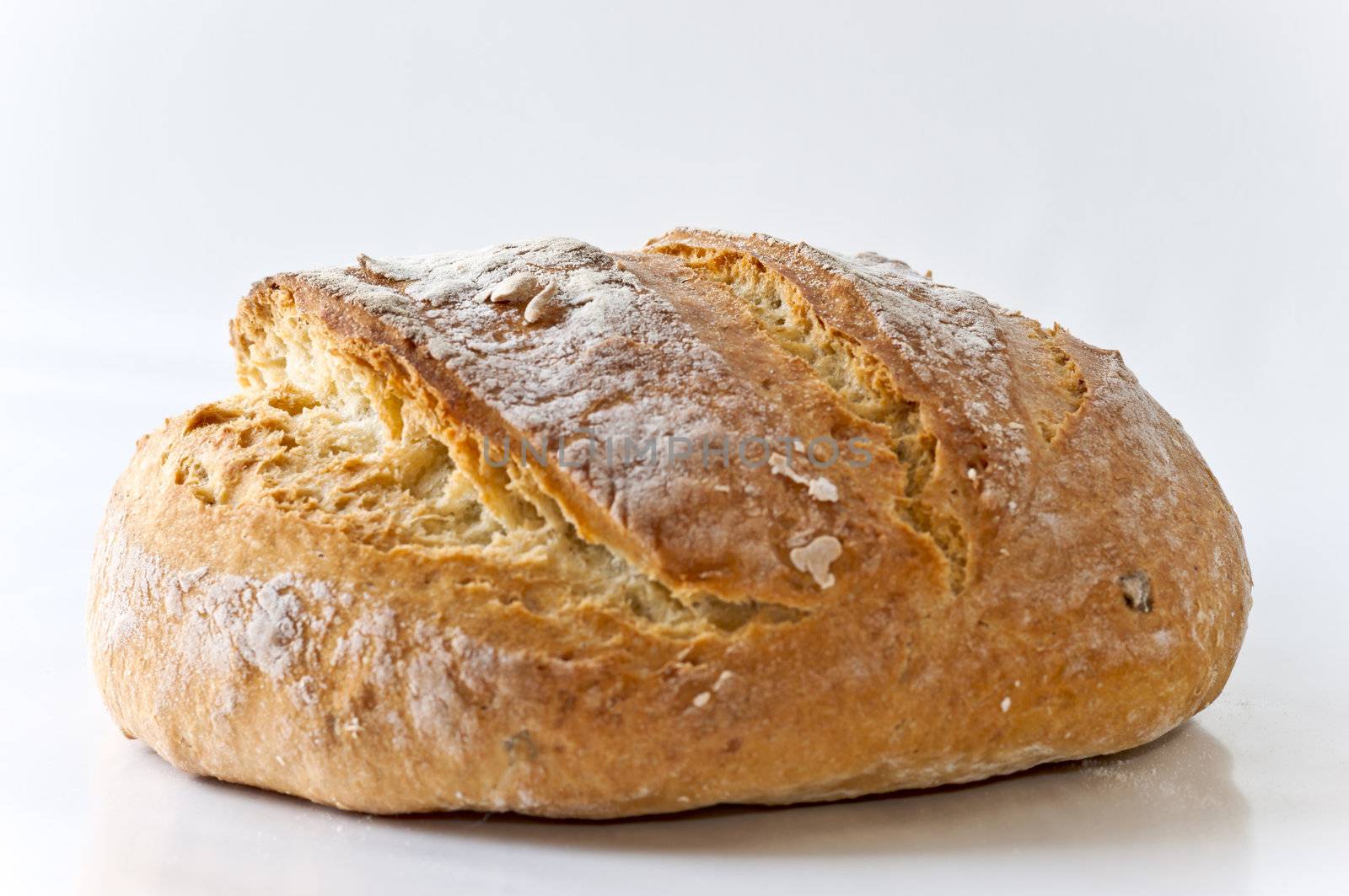 Honey white bread with poolish on white background close up