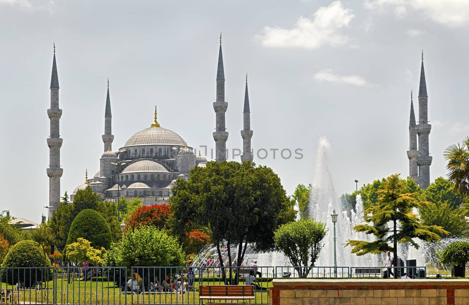 Landscape of the the Blue Mosque Istanbul, its fountains, gardens and general public picnicing in the grounds