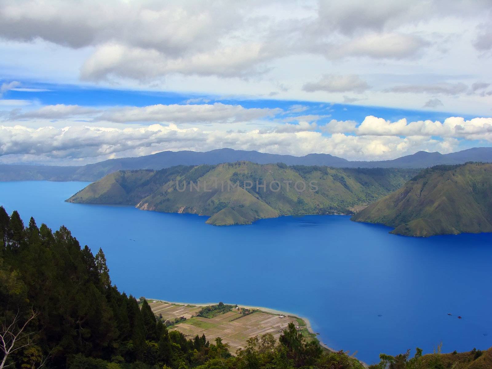 Lake Toba (Indonesian: Danau Toba) is a lake and supervolcano. The lake is 100 kilometres long and 30 kilometres wide, and 505 metres (1,666 ft) at its deepest point.                             