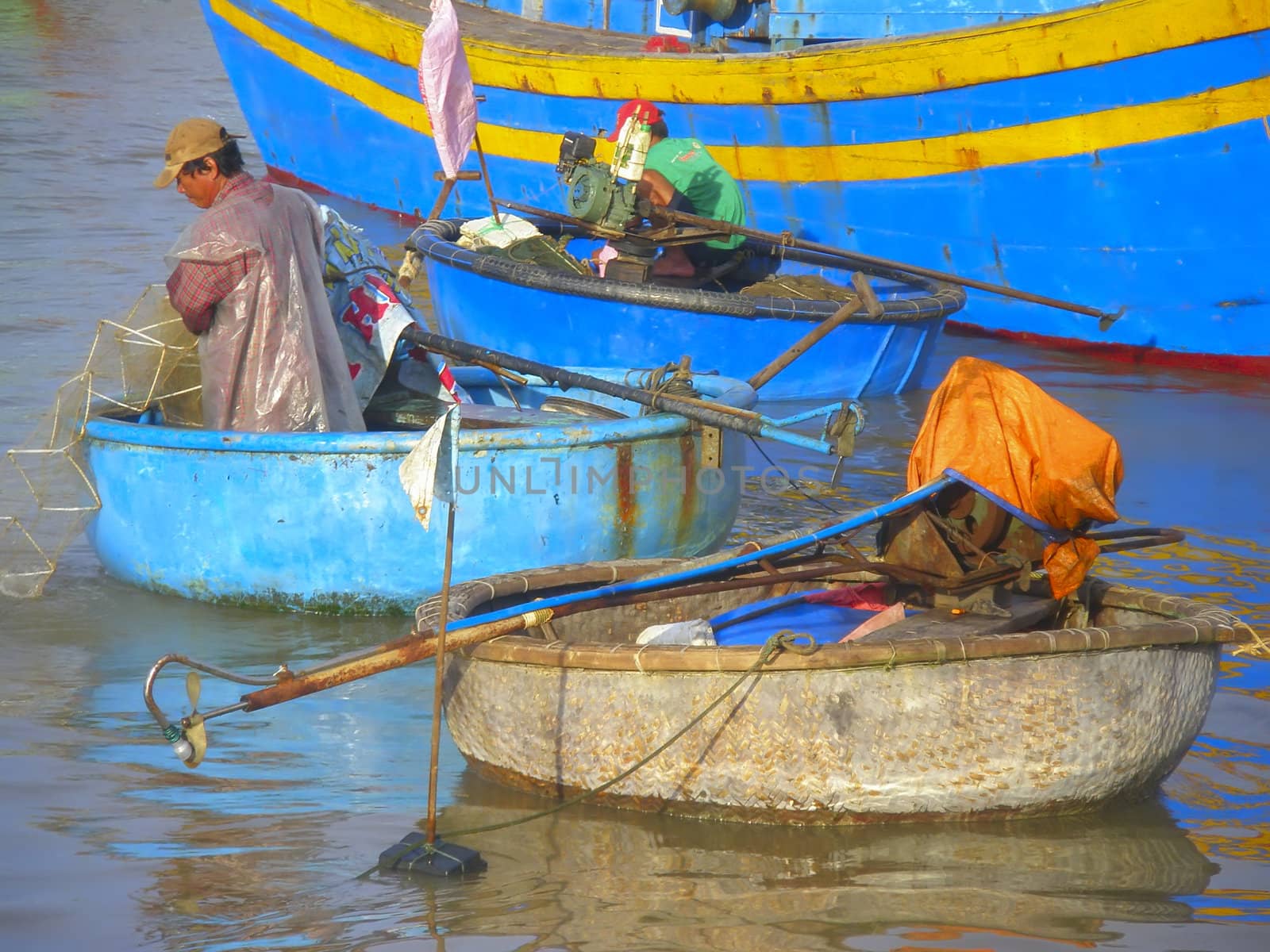 Vietnamese fisherman on the river near Phanthiet.