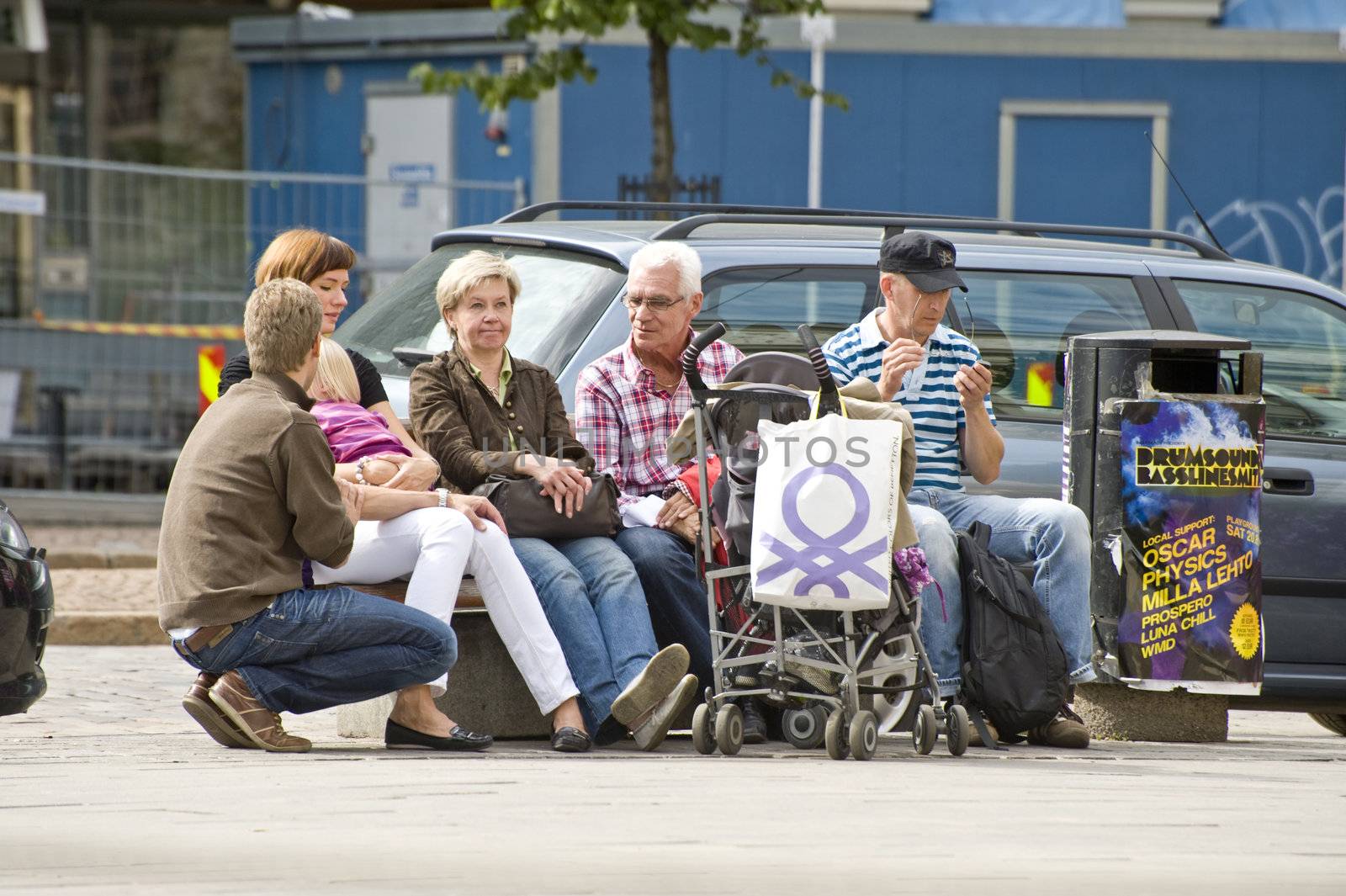 Tourists have a rest in the city, taken in Helsinki, Finland