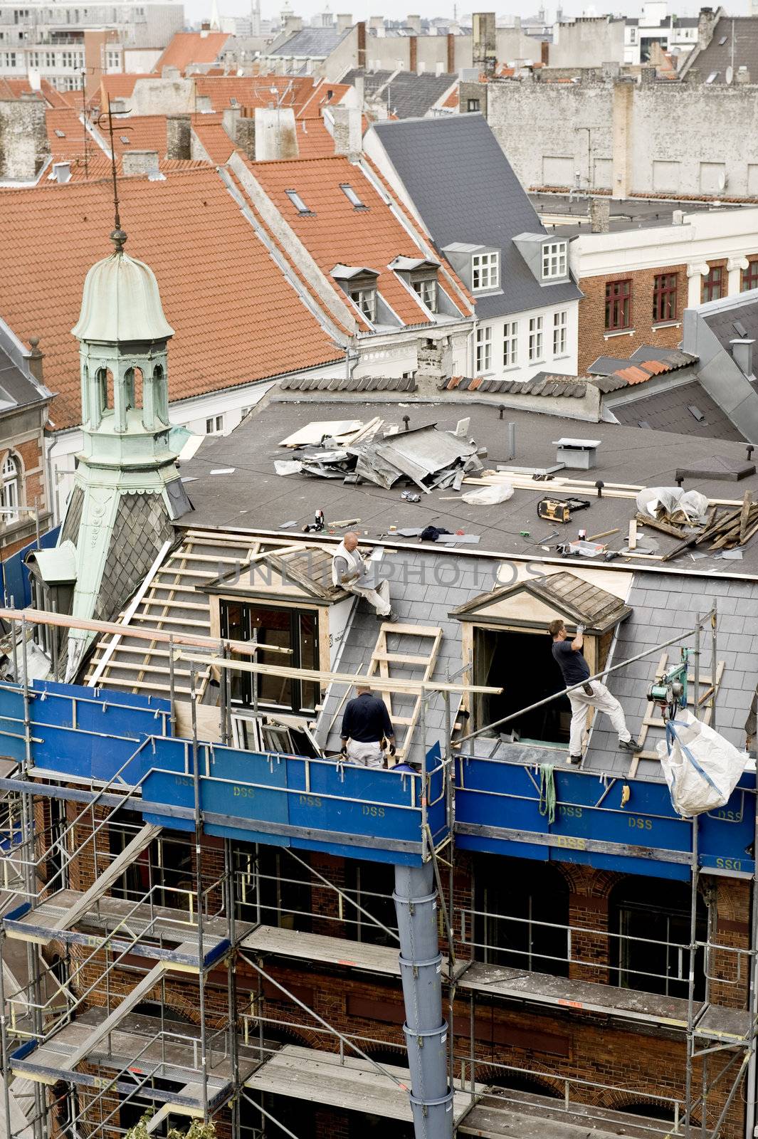 Building roof repair in Copenhagen, Denmark