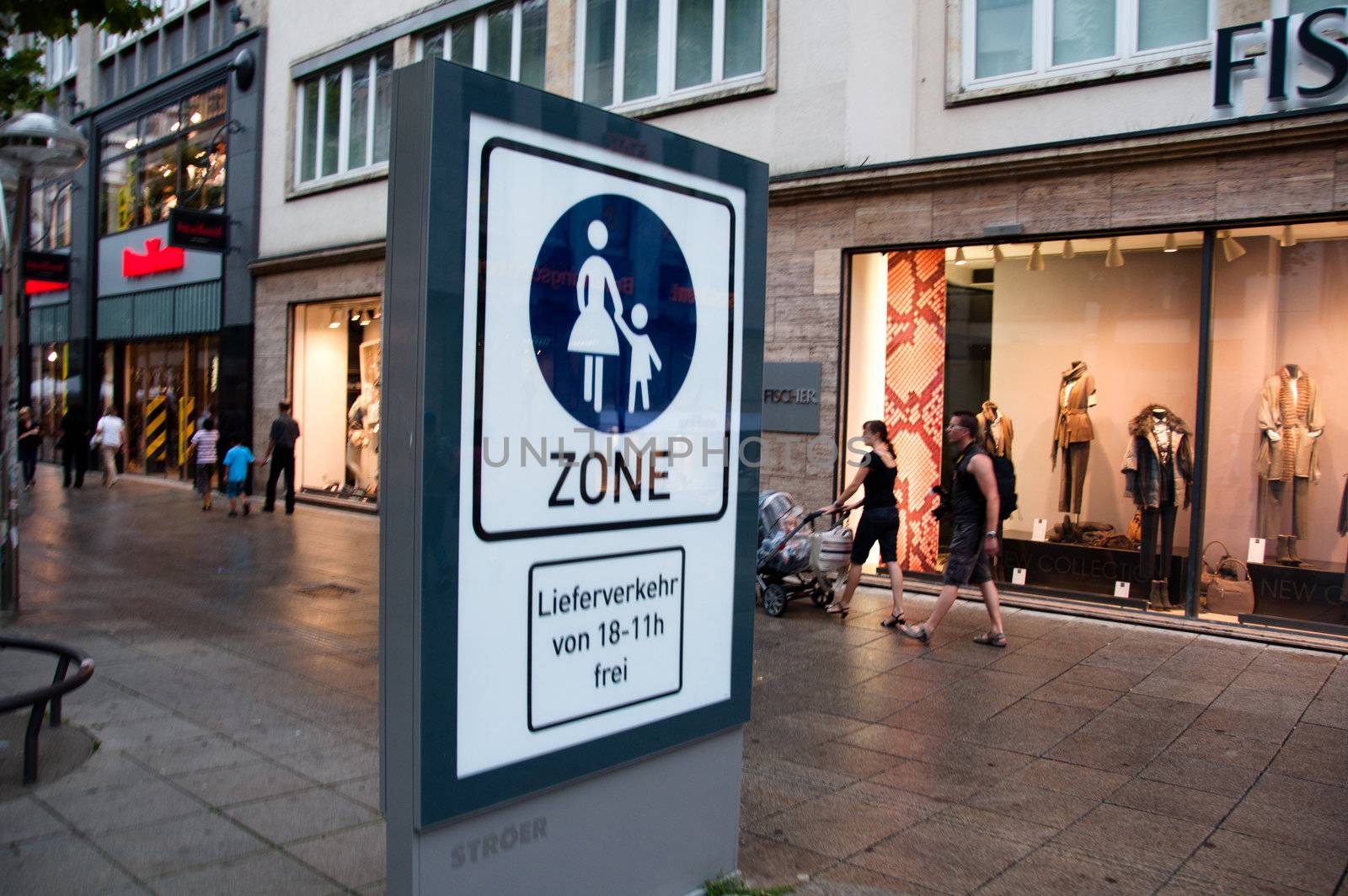 People walking in urban shopping area in Stuttgart, Germany by franky242