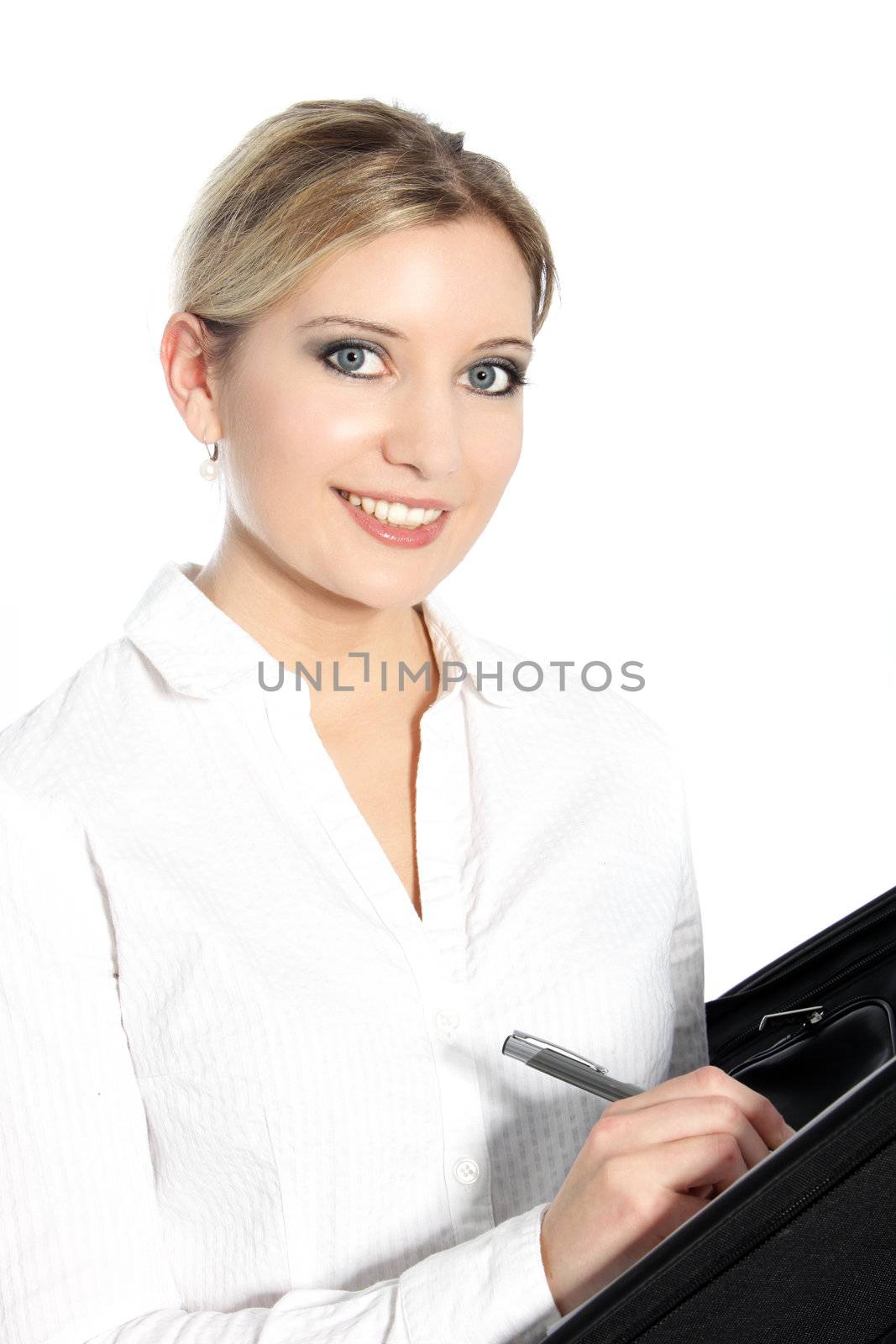 Beautiful young woman writing in a file which she is holding in her hands, isolated on white