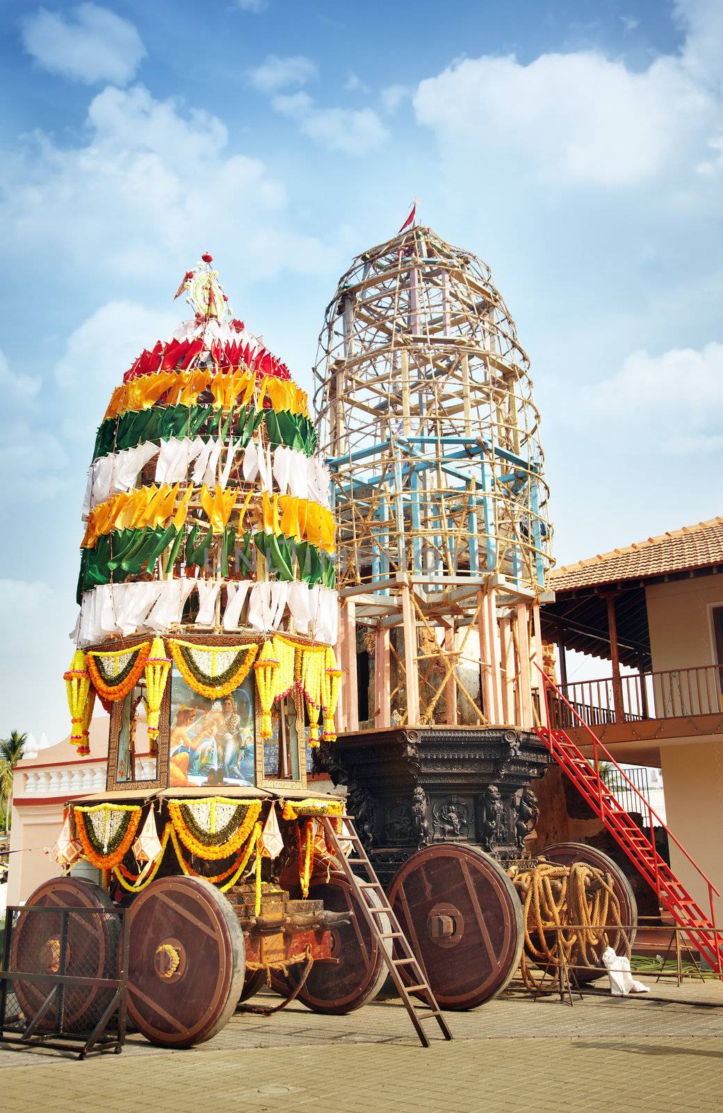 Traditional holly chariot with wooden wheels in the Indian religious temple. Preparation for Vishnu festival. India, Goa