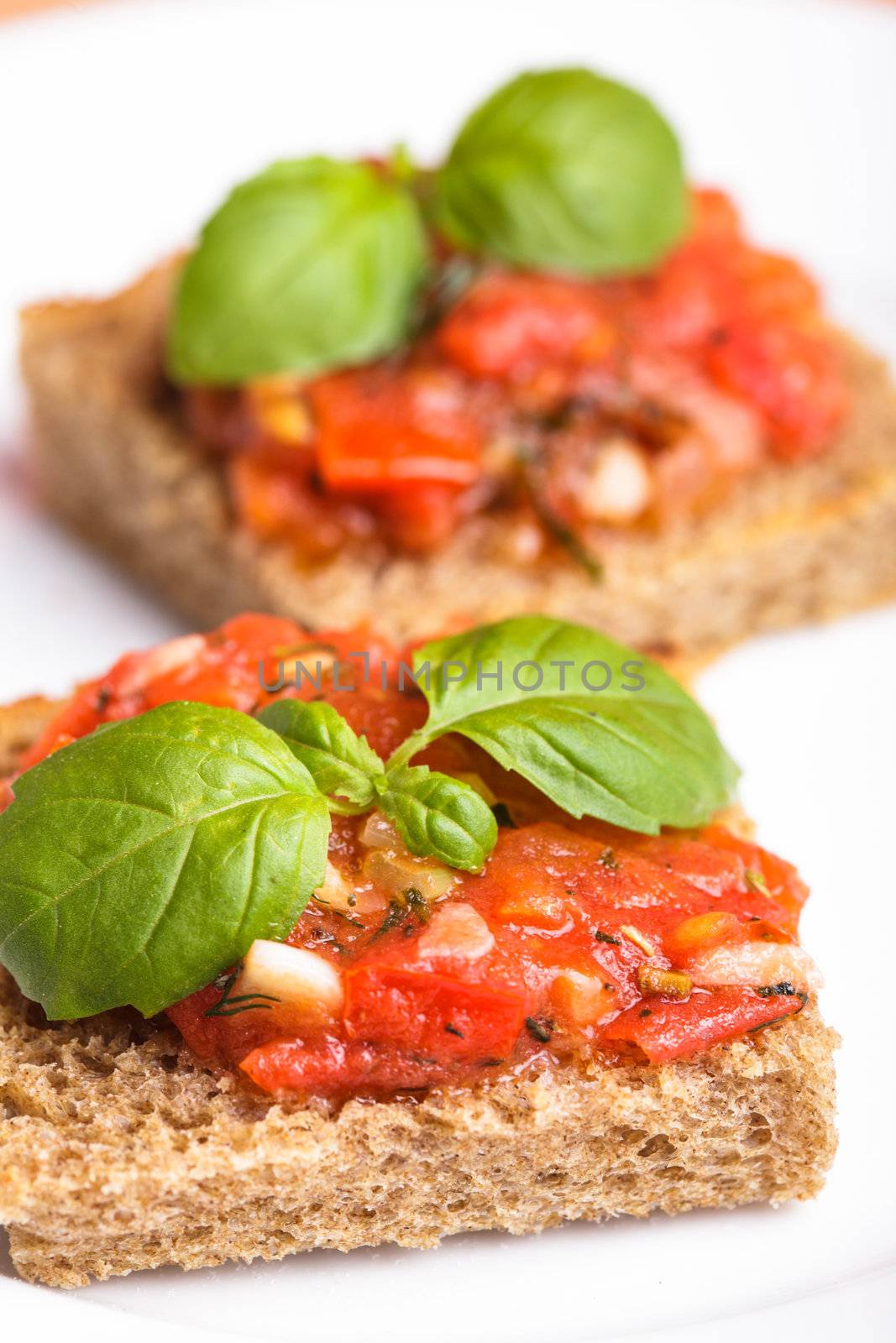 Crostini with tomato, garlic and basil. National italian dish