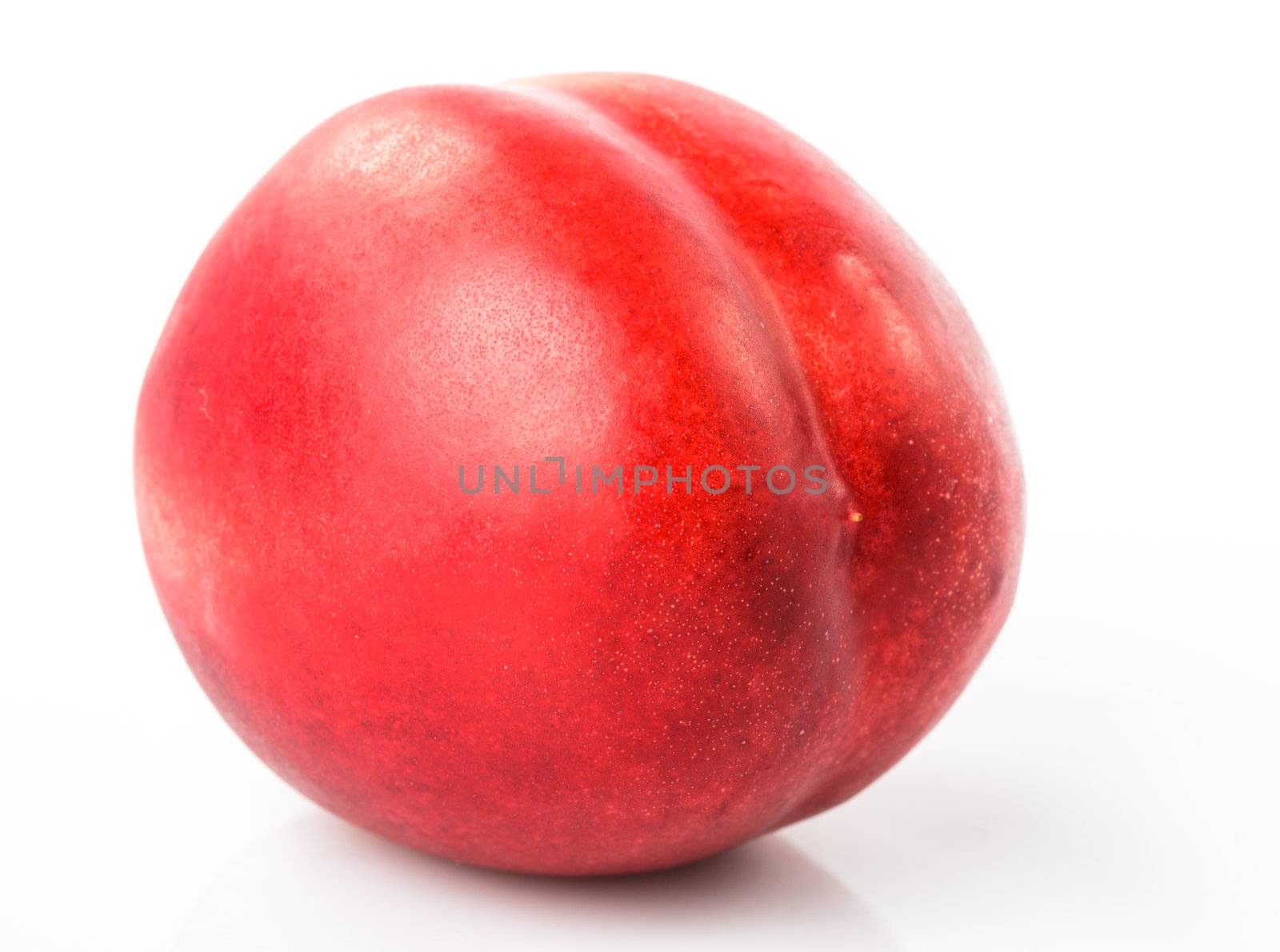 Nectarine fruit close up on white background