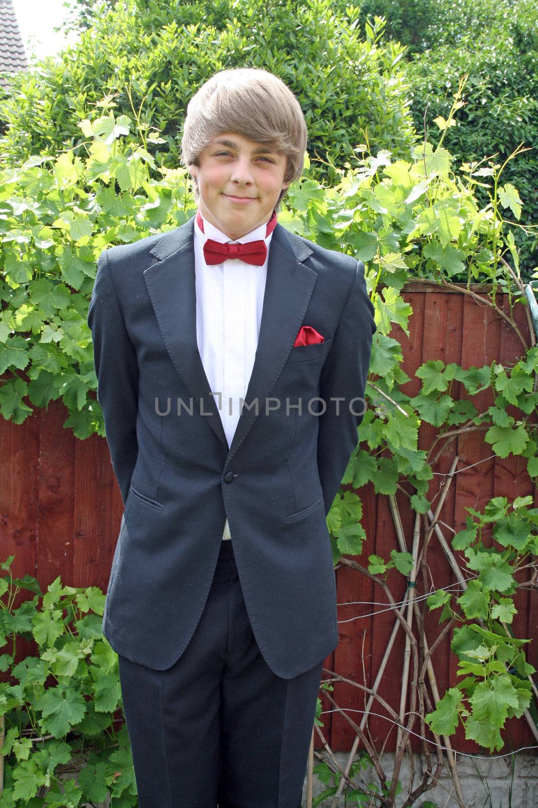 teenager in prom suit