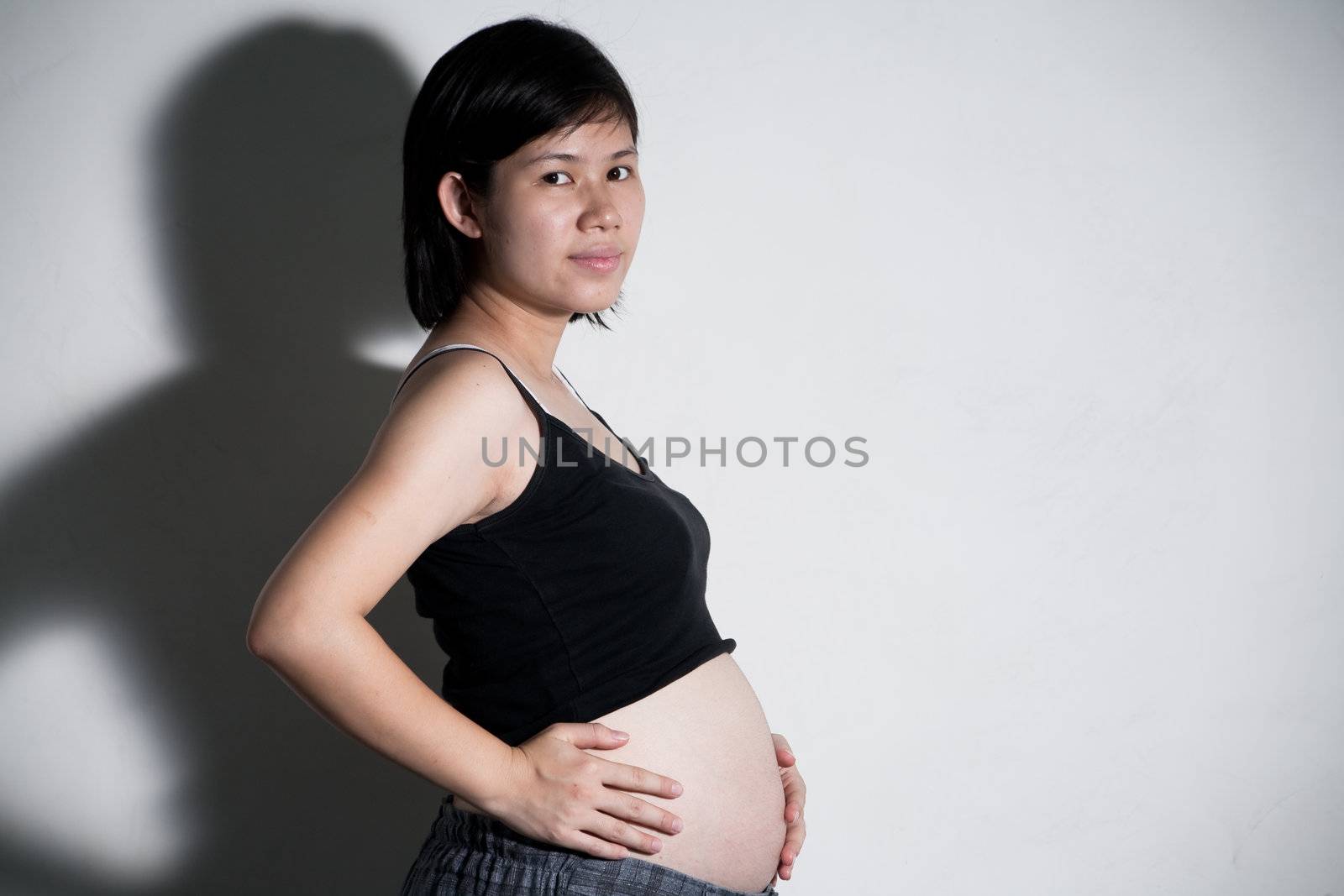 Portrait of pretty young woman. Future mother