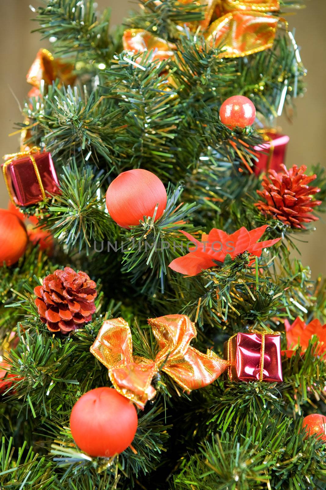 Christmas tree decorated with red balls and gifts