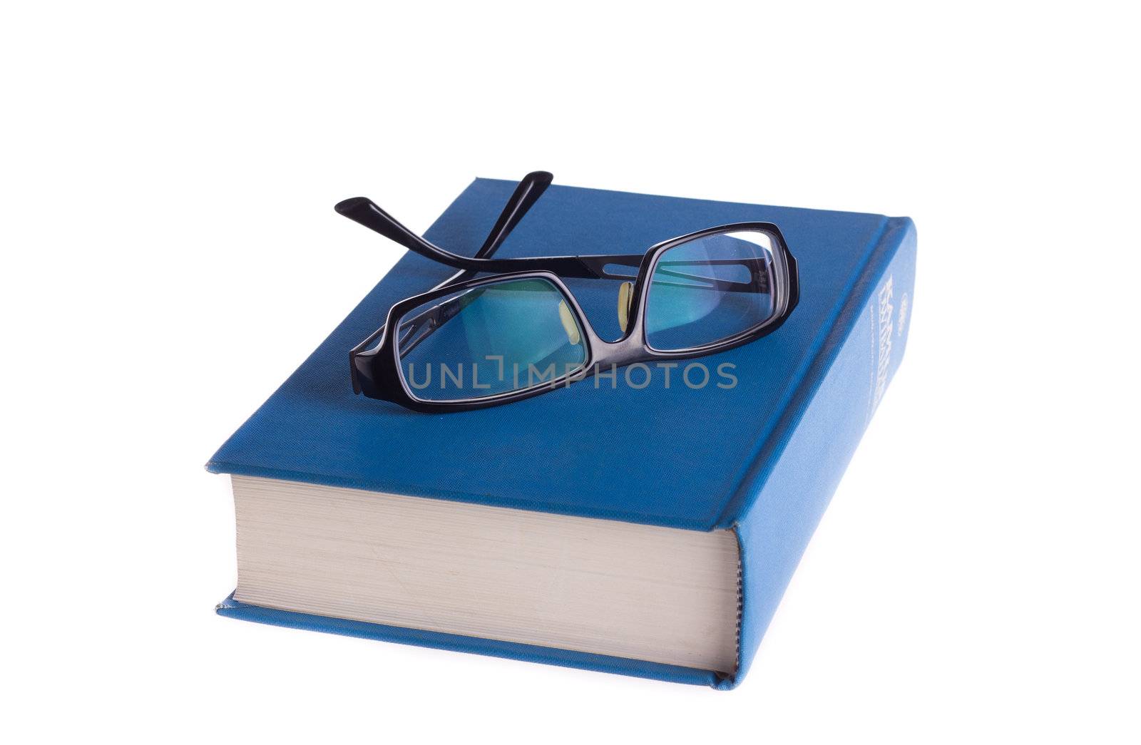 Reading glasses with books isolated on the white