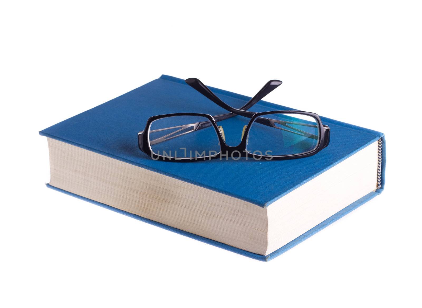 Reading glasses with books isolated on the white