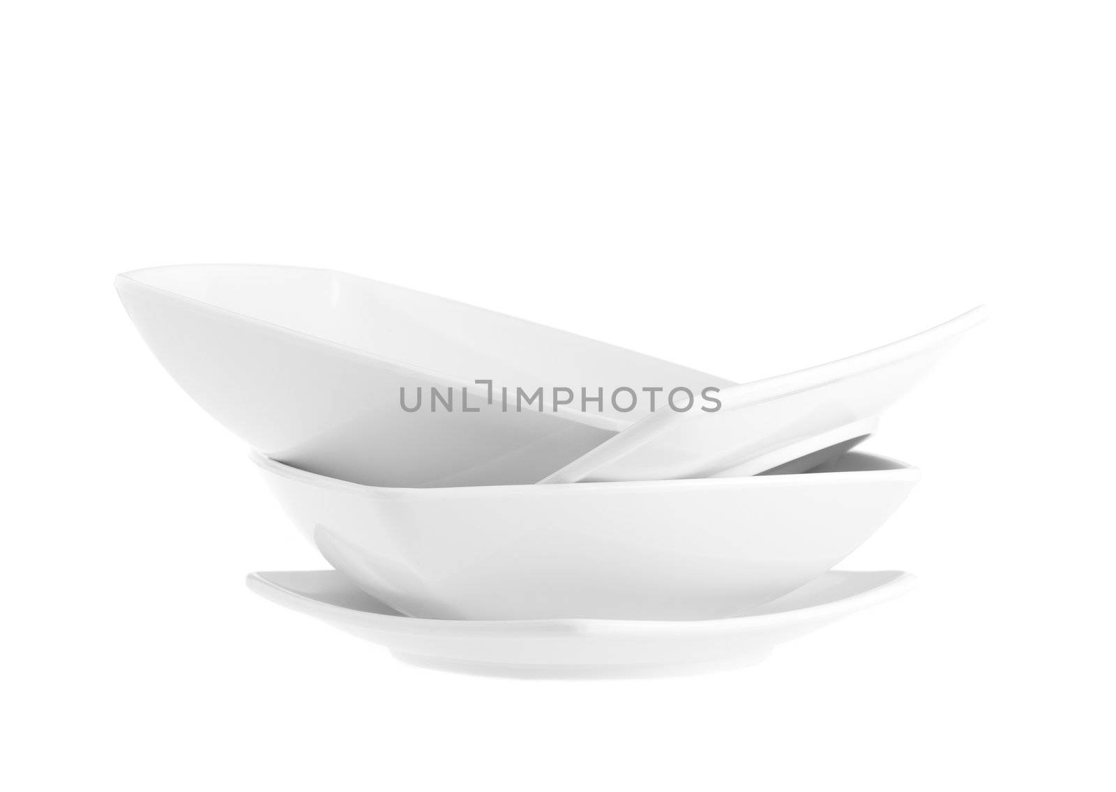 Stack of plain white dinner plates isolated on white background