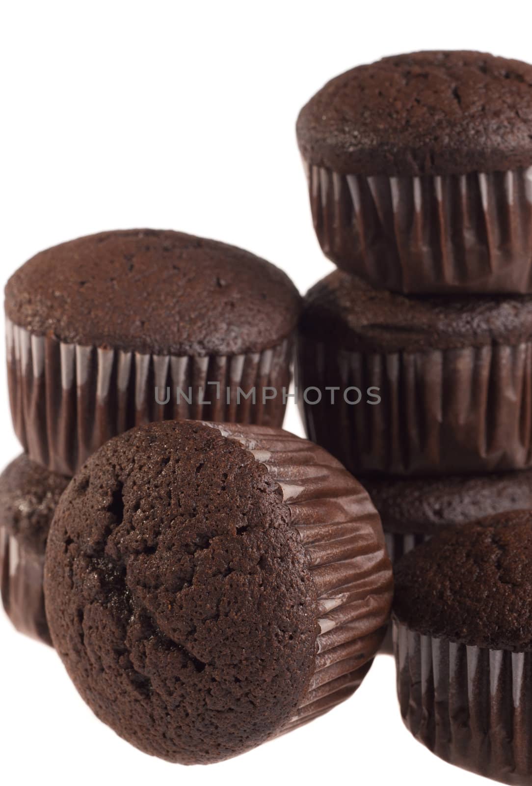 Chocolate muffin isolated on white background.