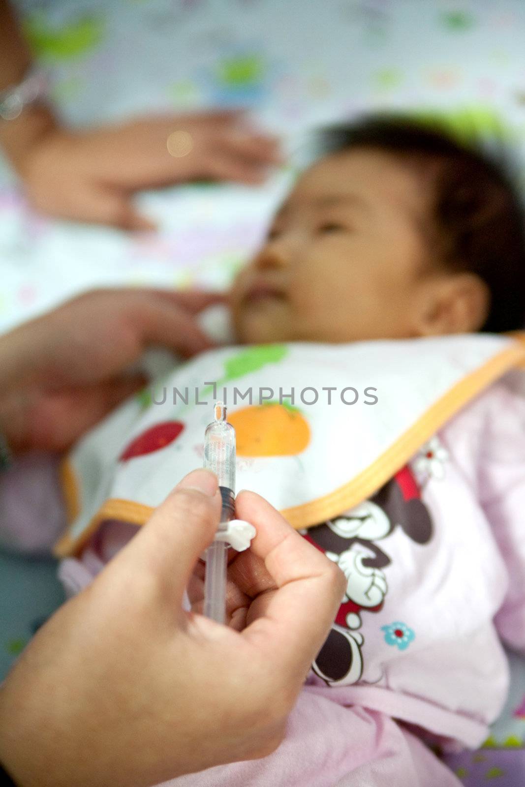 Doctor use a baby syringe.