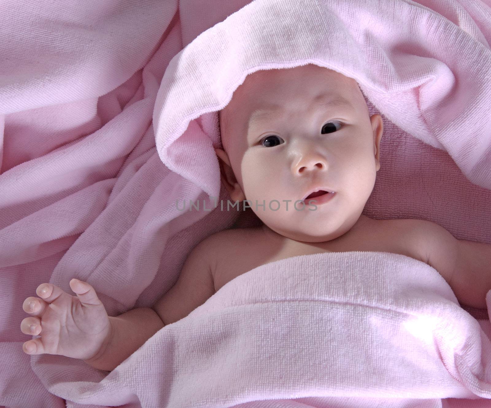 Baby after bath. Cheerful child.