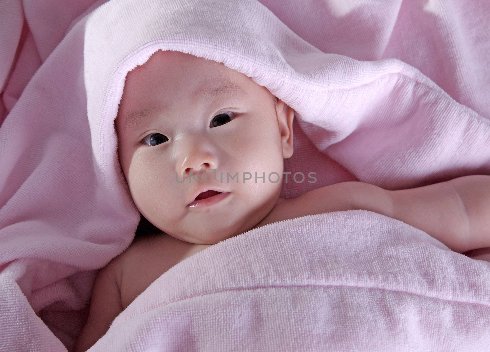 Baby after bath. Cheerful child.