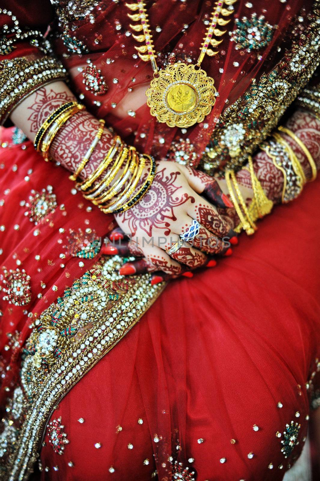 Indian bride with beautiful henna on her wedding day
