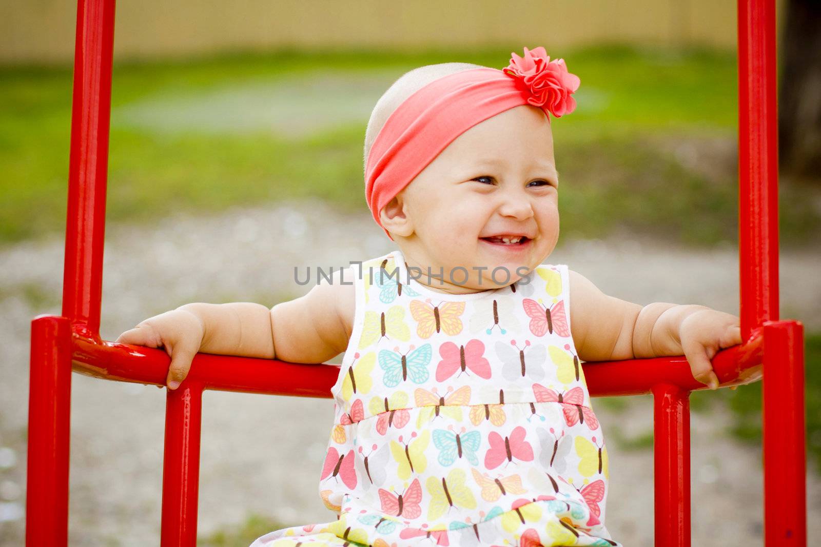 Cute little girl on the swings by Lemuana