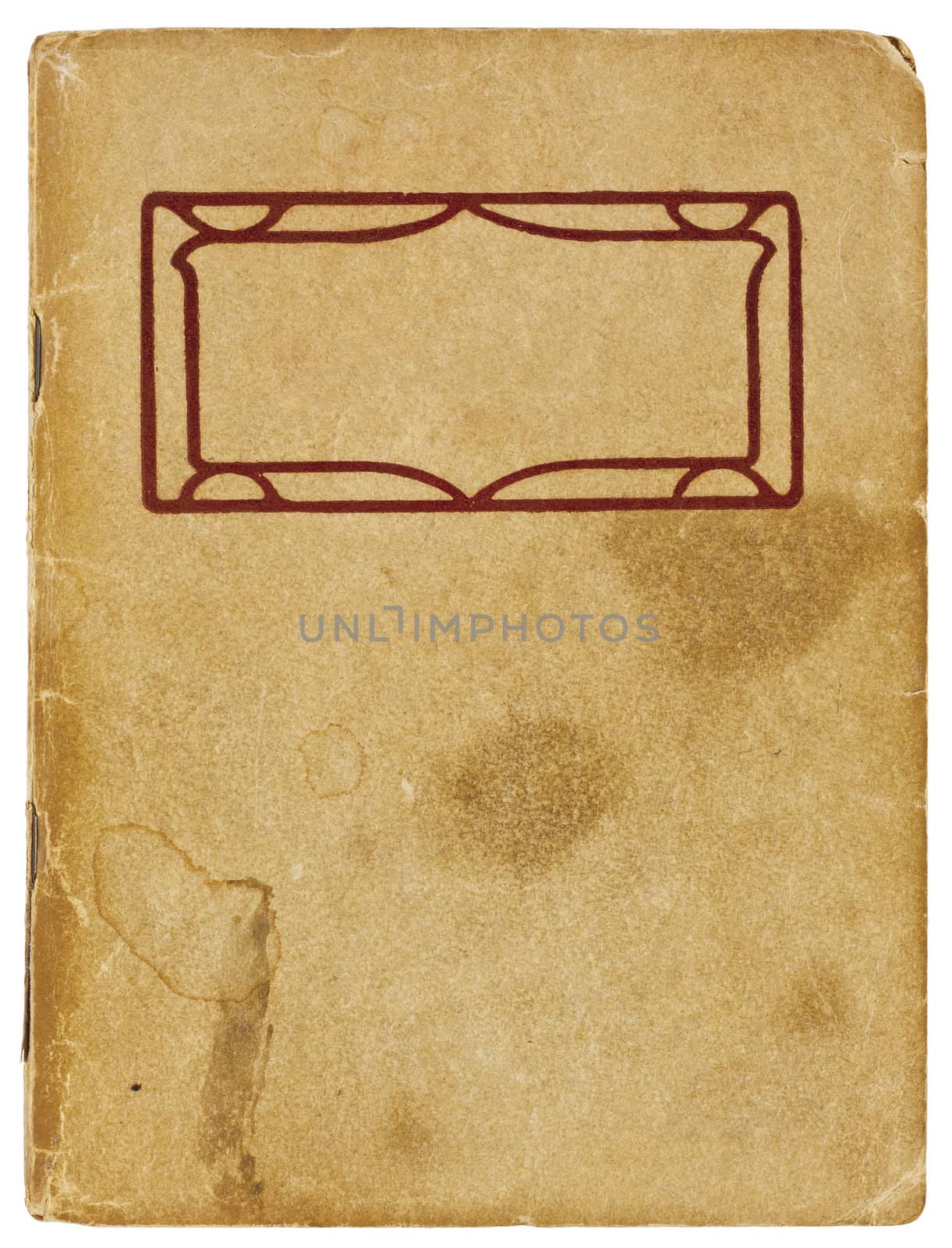 An old booklet viewed from above. The yellowing cover is water stained and creased with rough edges and dog-eared corners and is blank except for a decorative red title border. Isolated on white with clipping path.