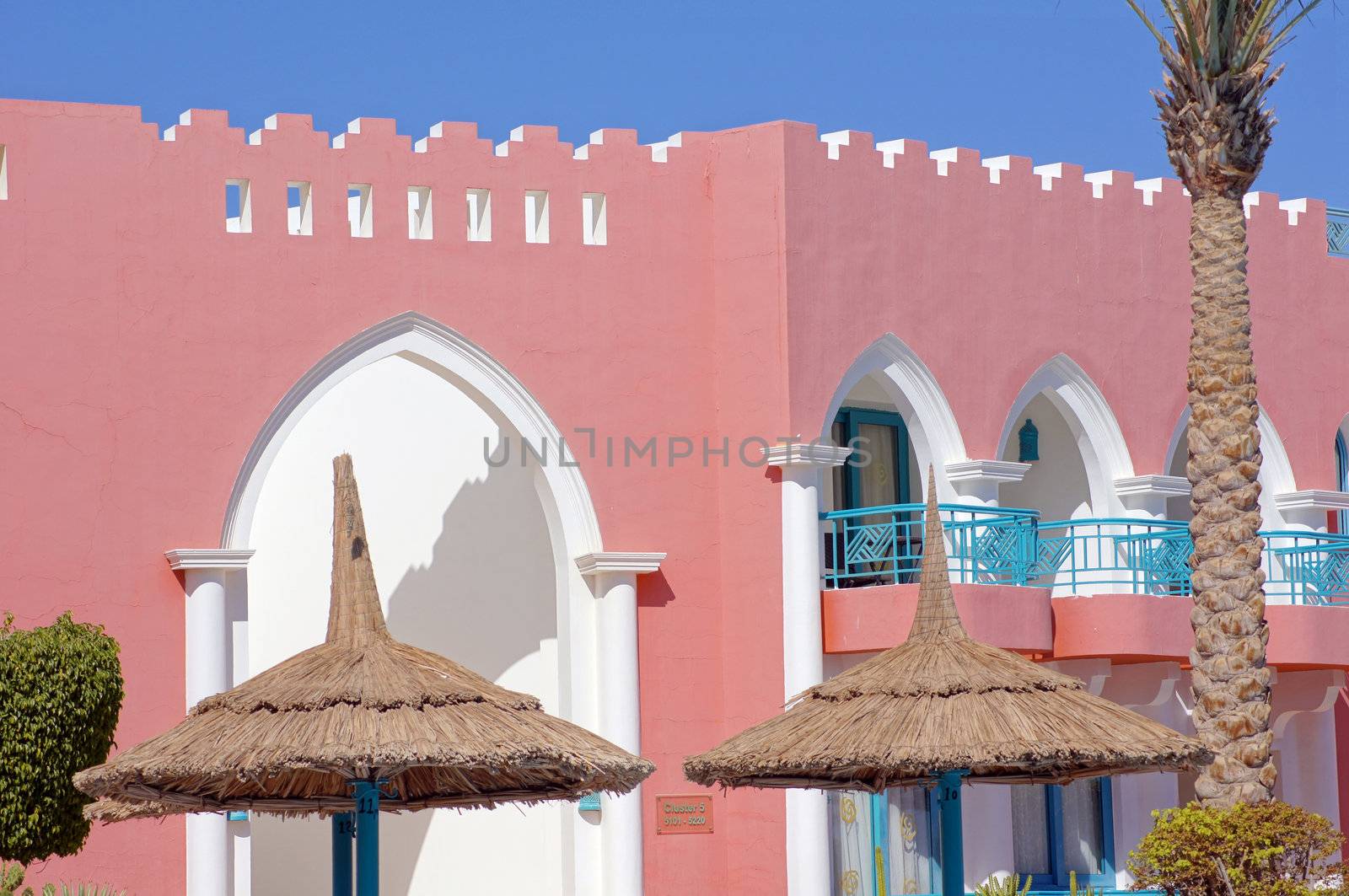 Arabic architecture: red walled building         