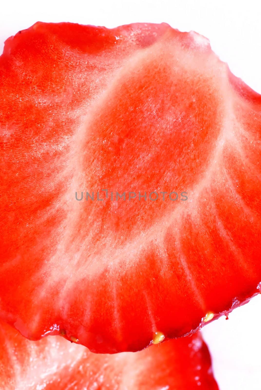 ripe red strawberry halved on white background closeup