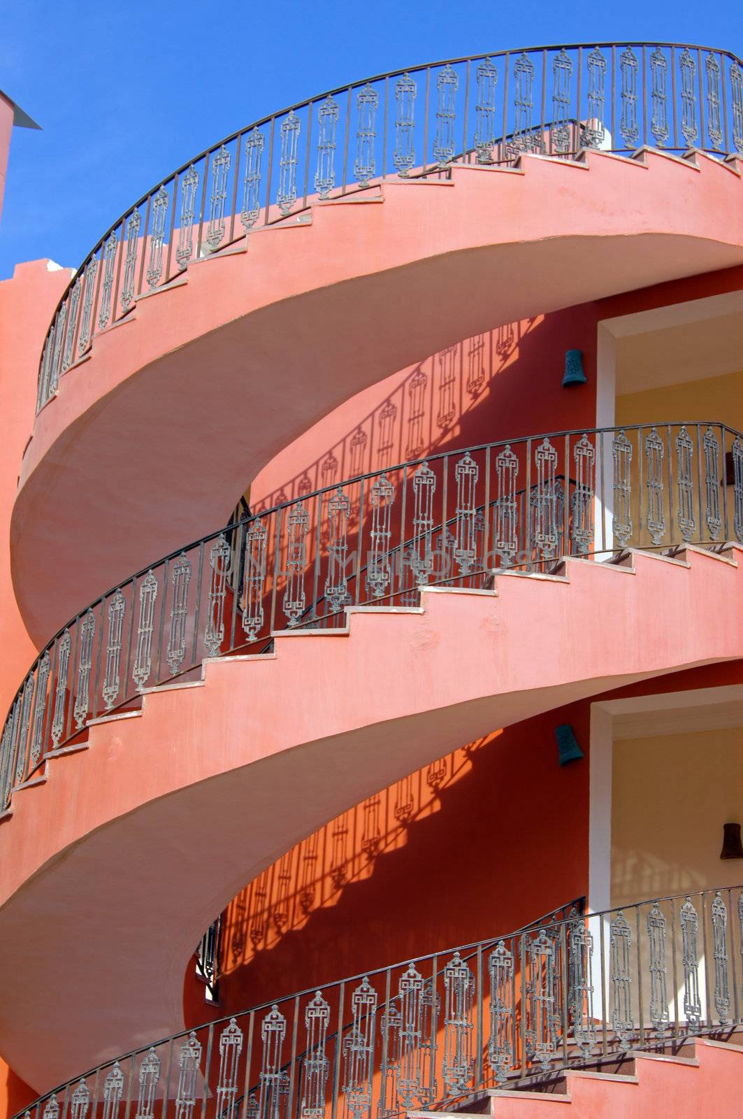 arabic architecture: spiral staircase and blue sky               