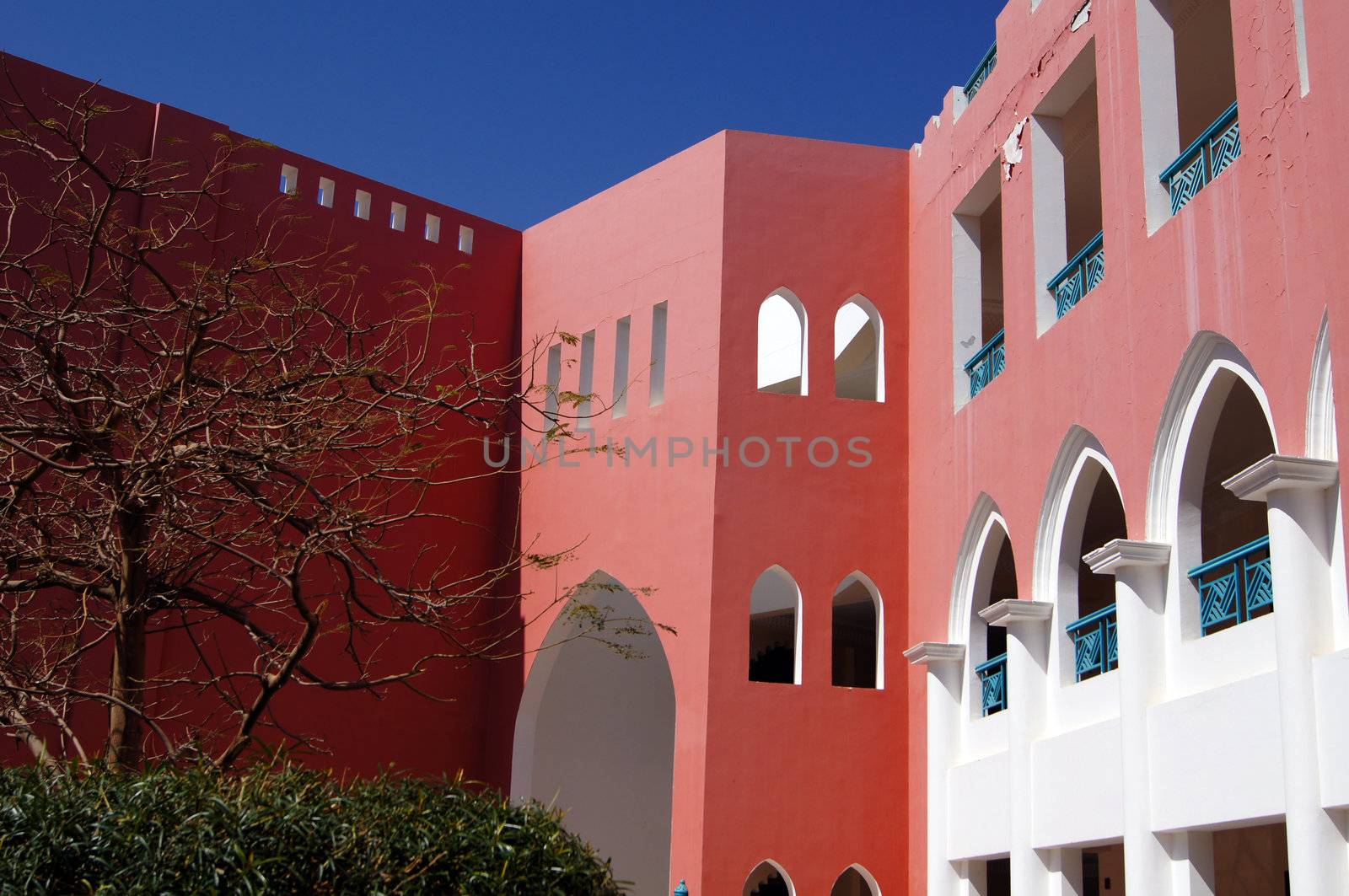 Arabic architecture: red walled building             