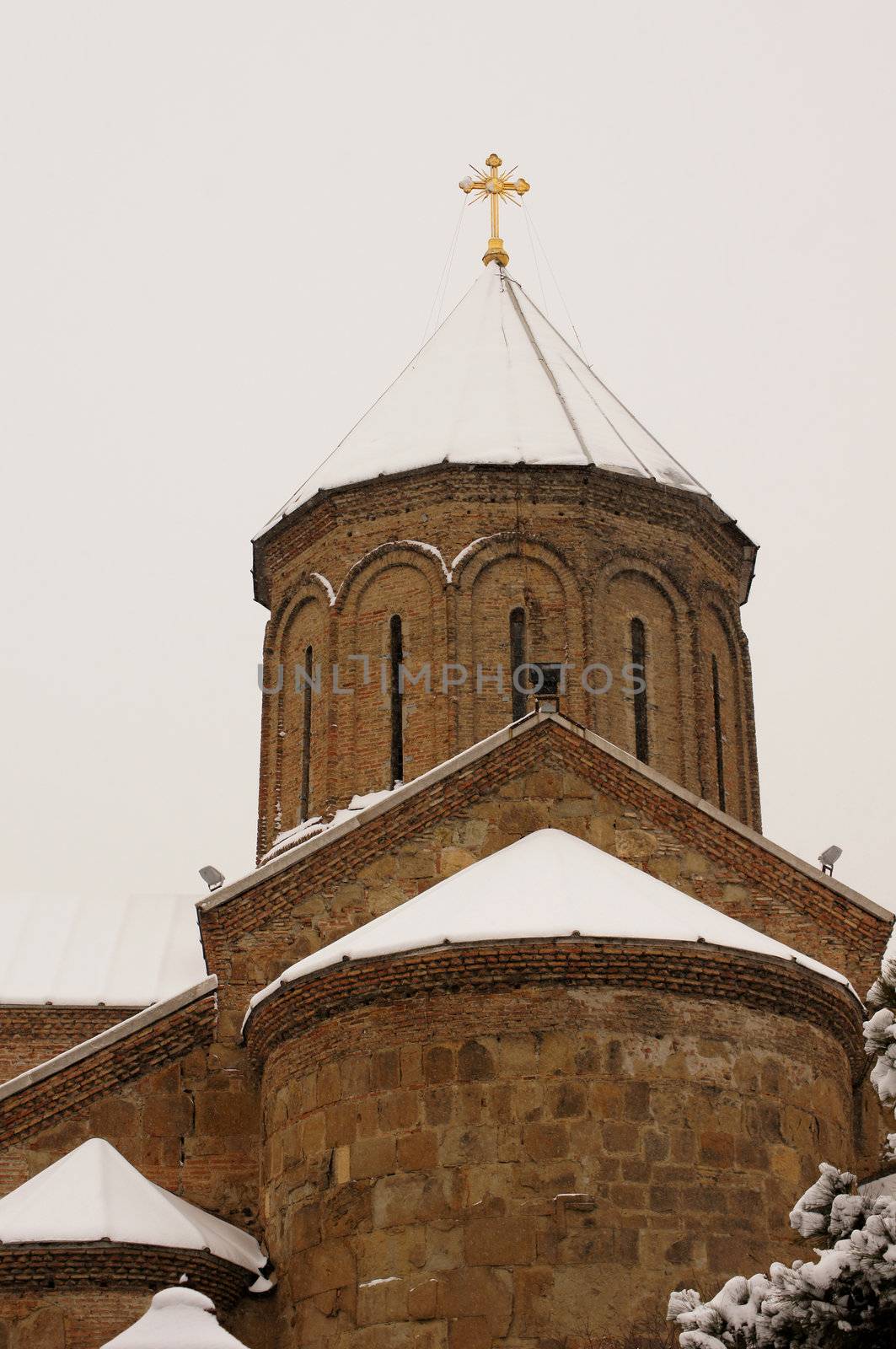 Winter view to covered with snow Tbilisi Old town in misty day