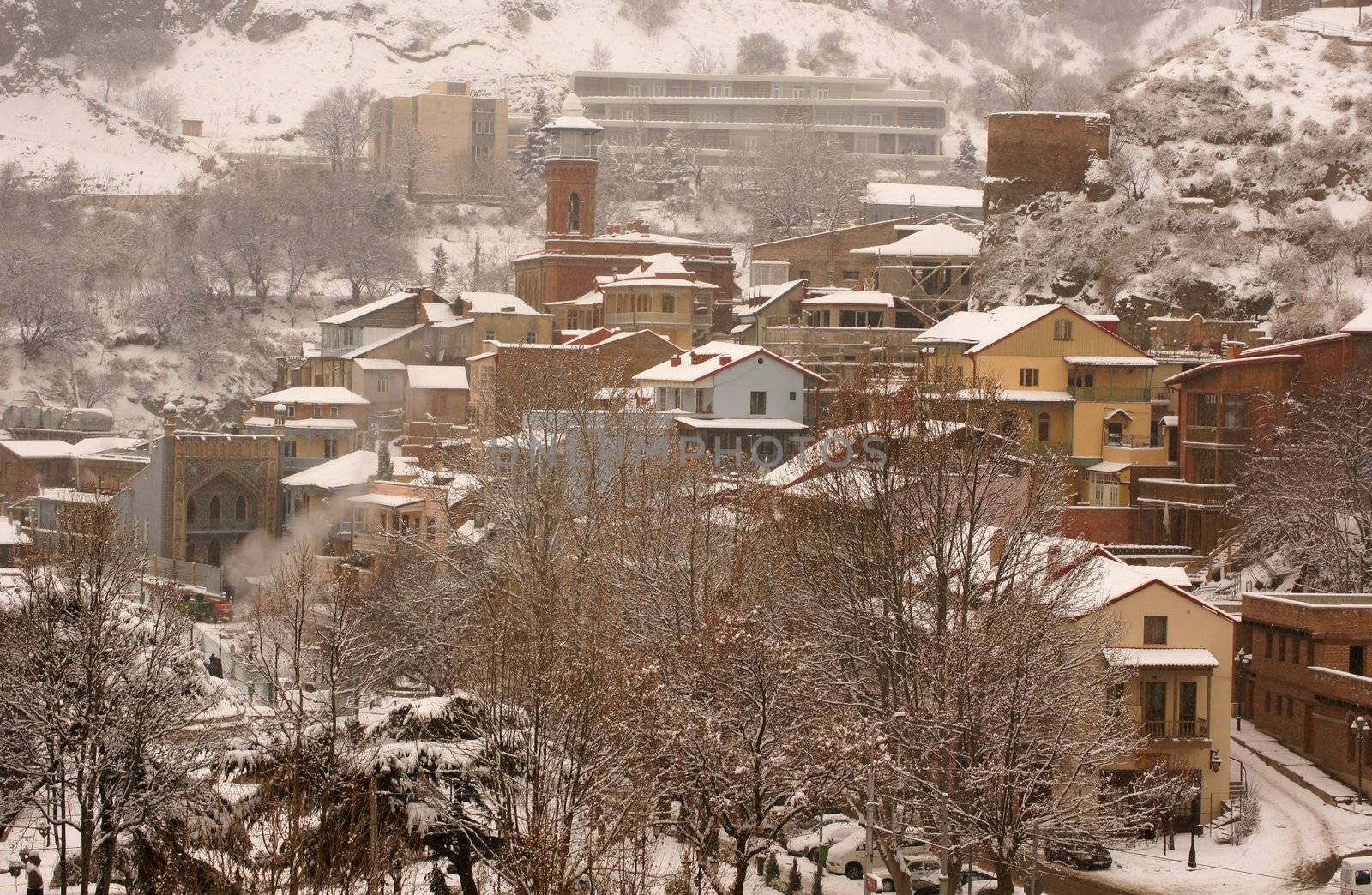 Winter view to covered with snow Tbilisi Old town in misty day