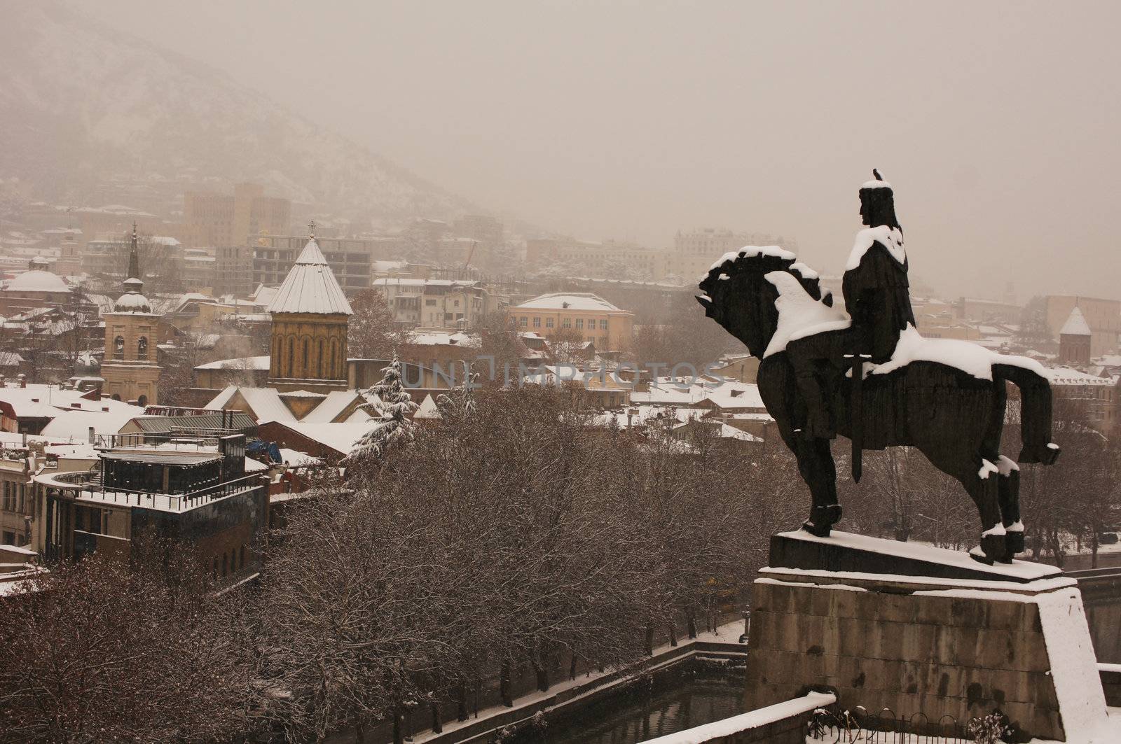 Winter view to covered with snow Tbilisi Old town in misty day