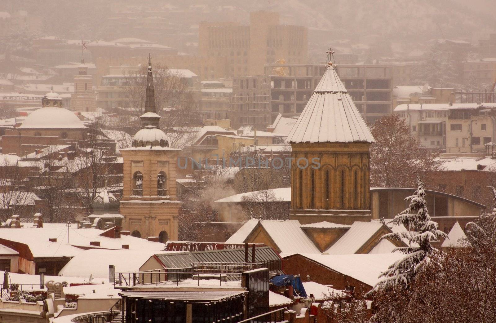 Winter view to covered with snow Tbilisi Old town in misty day