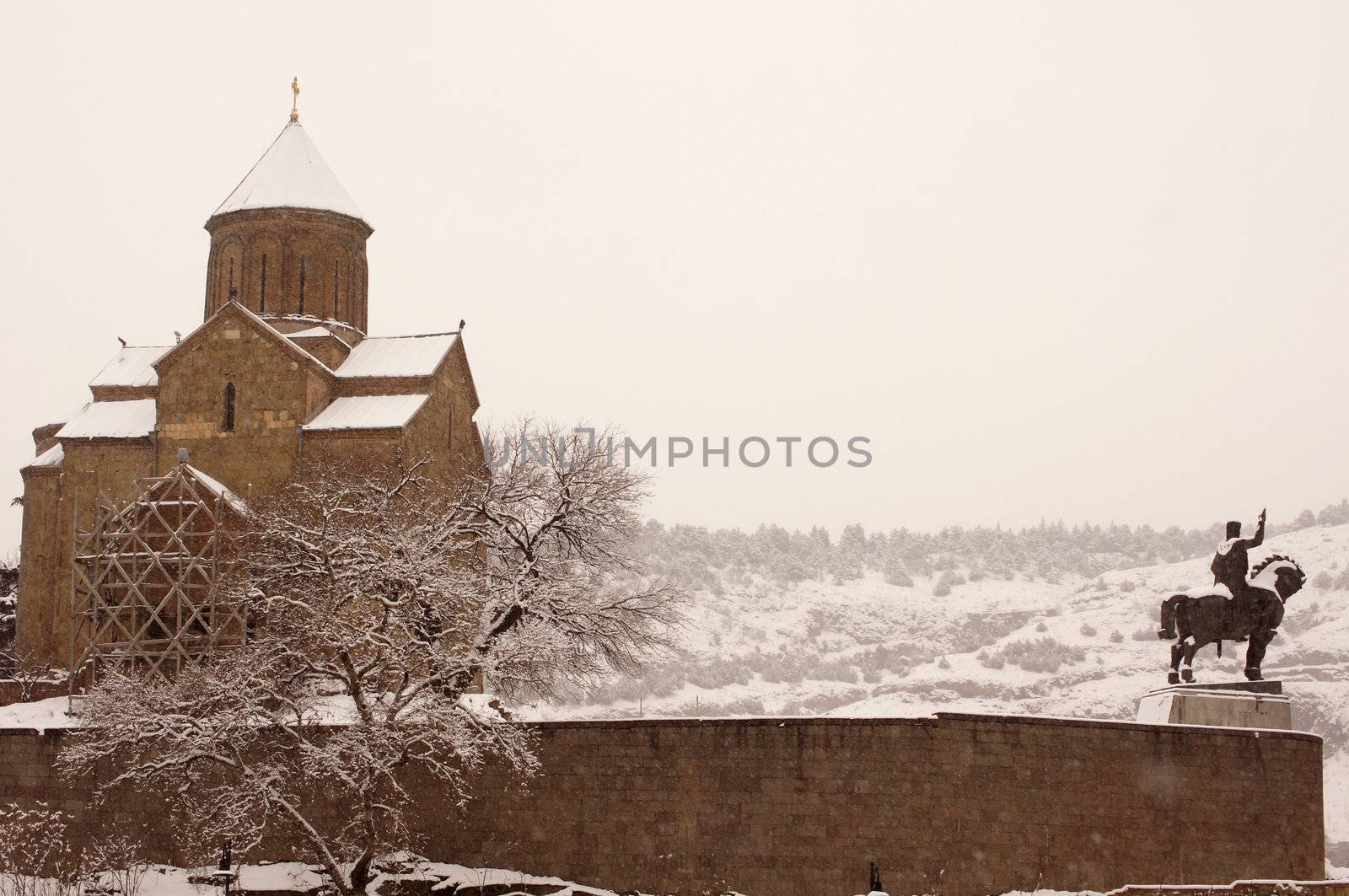 Winter view to covered with snow Tbilisi Old town in misty day by Elet