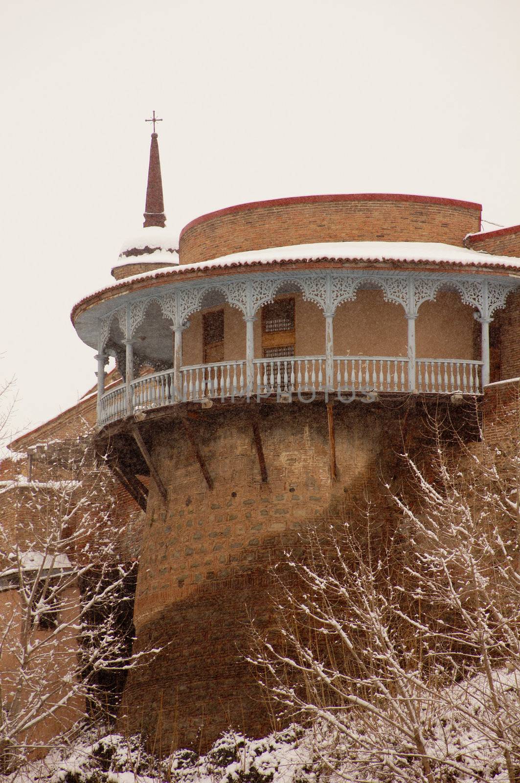 Winter view to covered with snow Tbilisi Old town in misty day by Elet