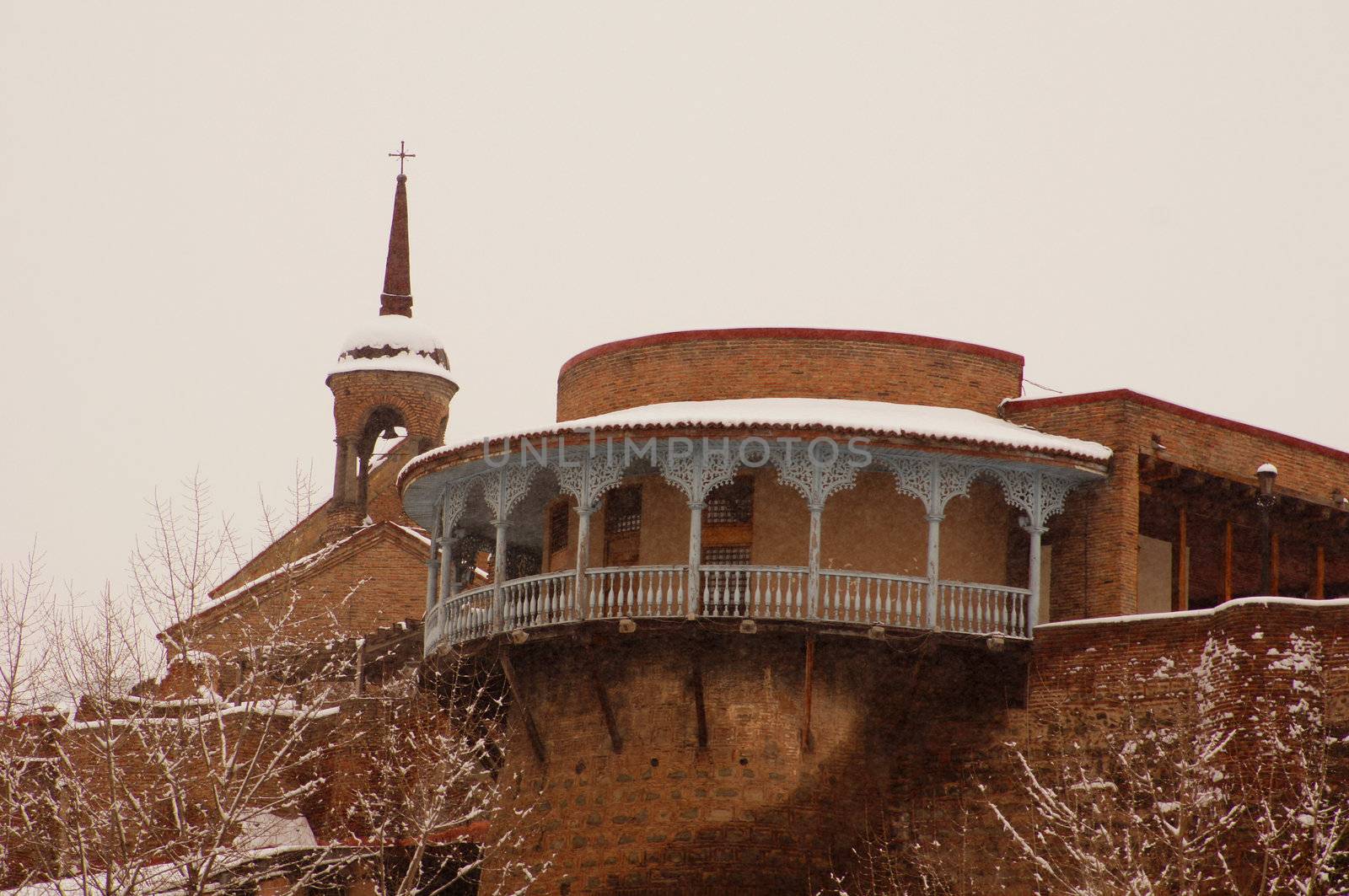 Winter view to covered with snow Tbilisi Old town in misty day by Elet